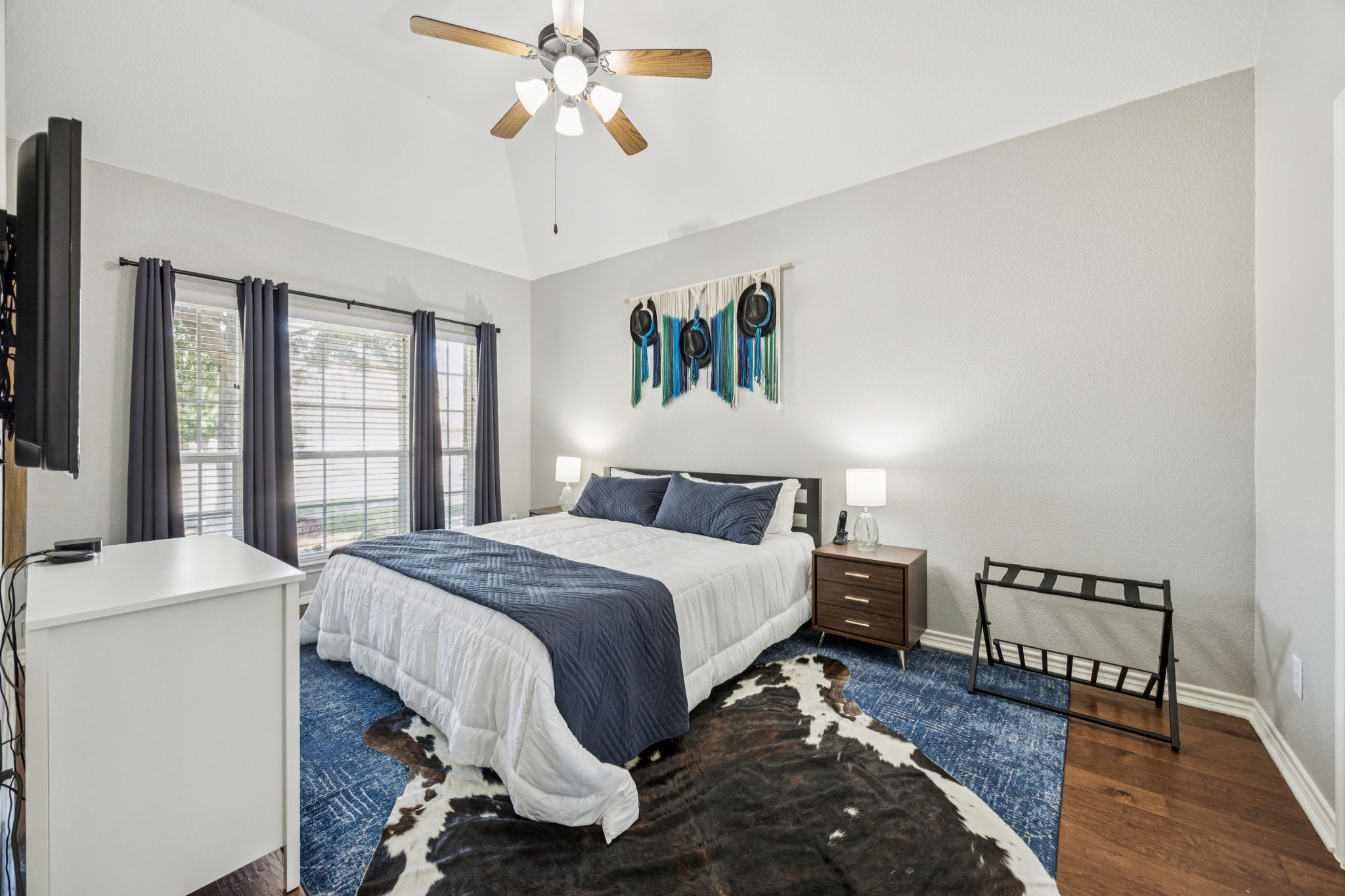 Cozy king bed with crisp, comfortable linens.