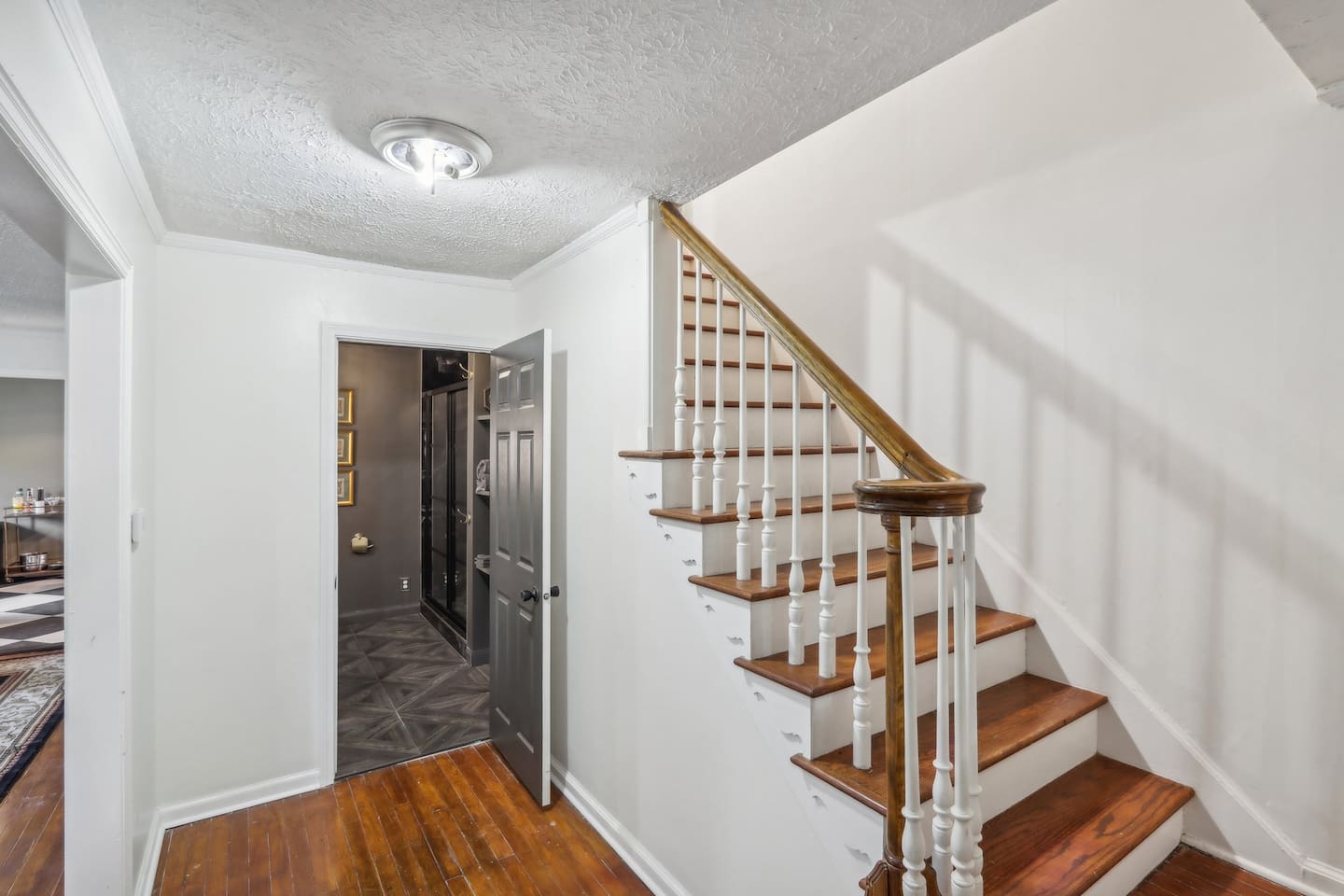 Move easily between levels from this interior staircase, featuring warm wood steps.