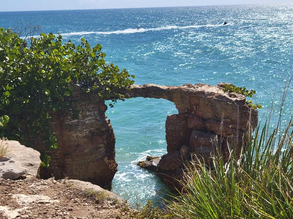 Scenic Escape: Marvel at breathtaking ocean views through natural rock formations around Cabo Rojo!