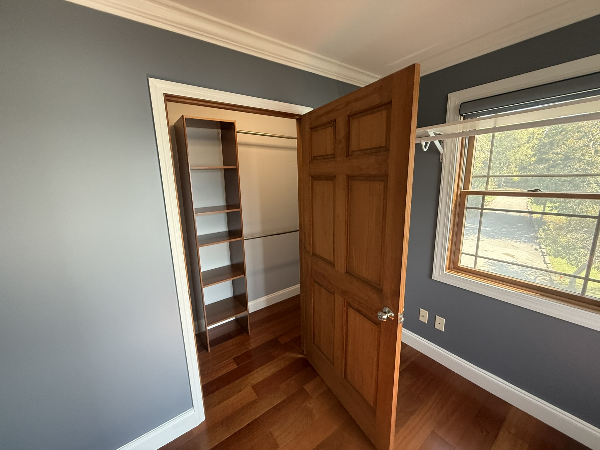 A 2nd closet area and shelving for bedroom 1
