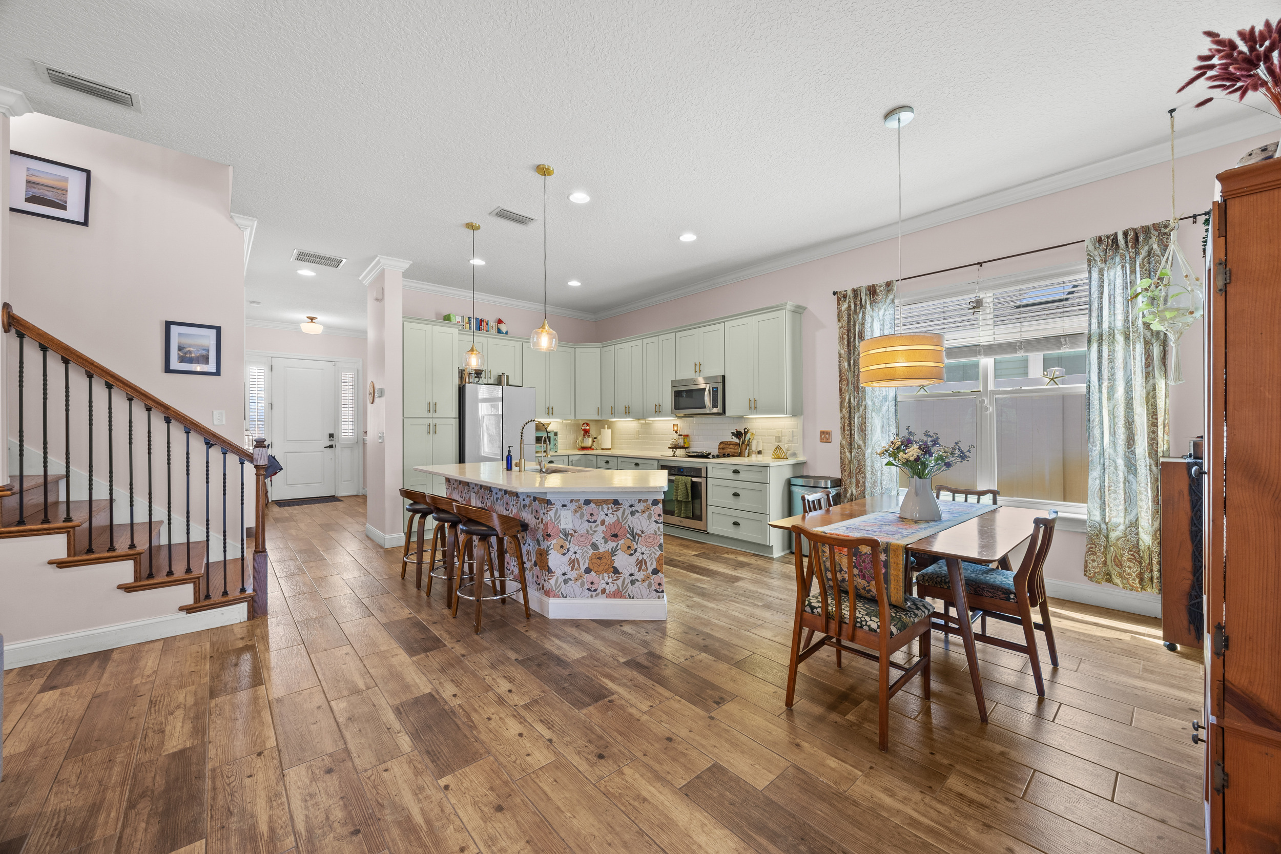 Bright kitchen with modern appliances and dining area — perfect for cooking and gathering.
