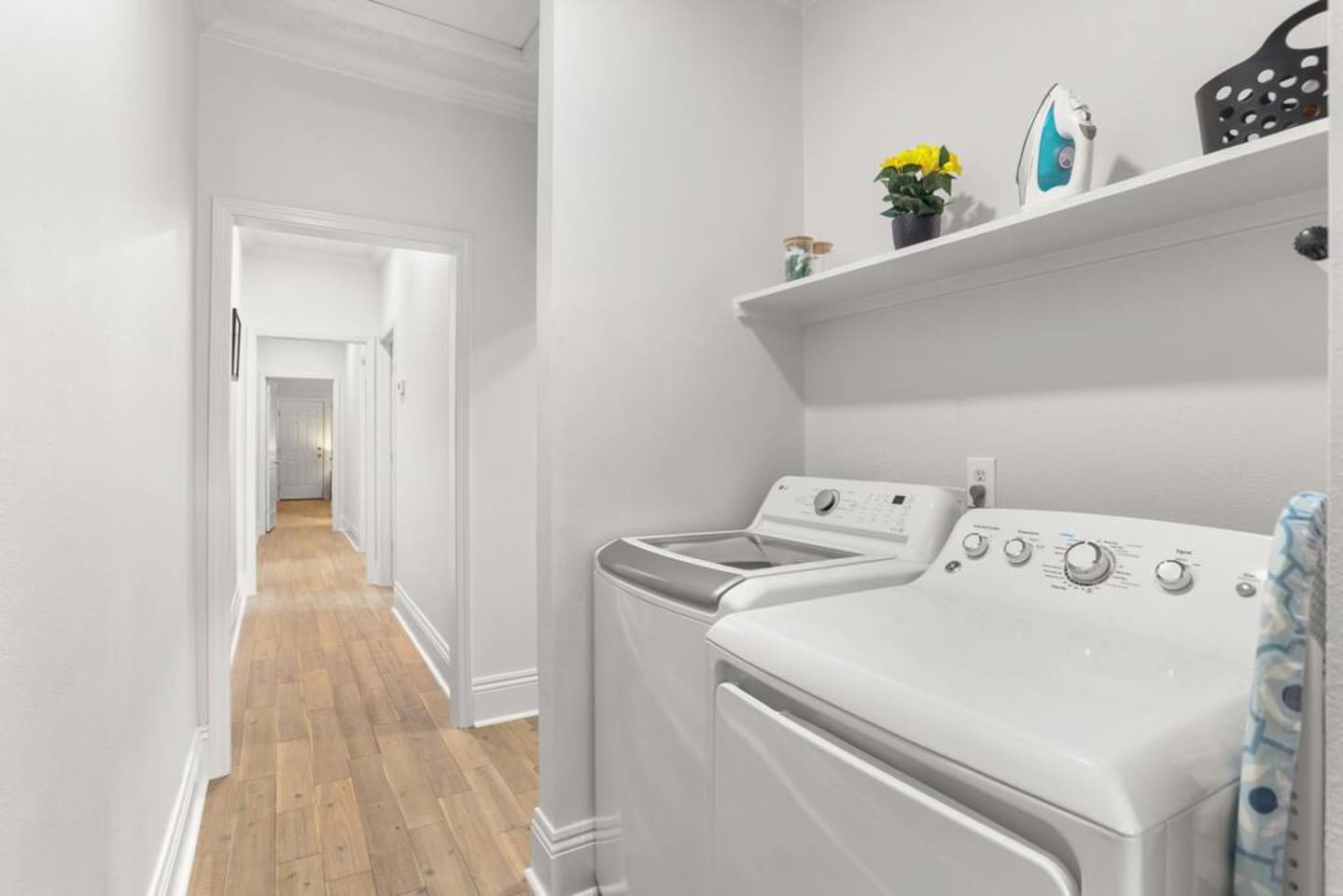  No need to overpack with your own new washer and dryer and complimentary detergent for a mid-stay wash! Plus iron and ironing board to get you ready for a night out!  Plus note the gorgeous wood floors (like the rest of the house)