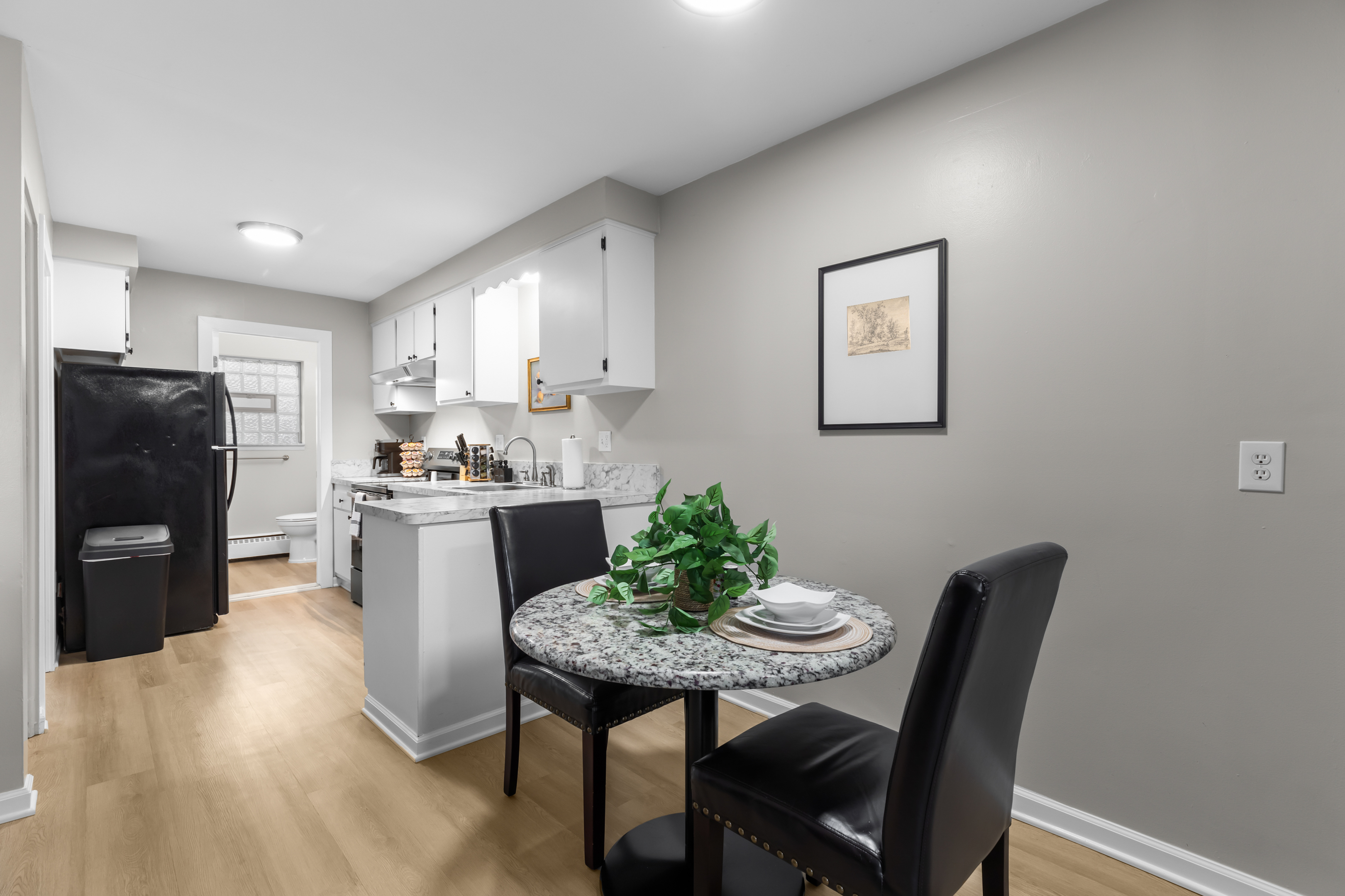 Gather with friends and family for a delicious meal in this cozy dining room.