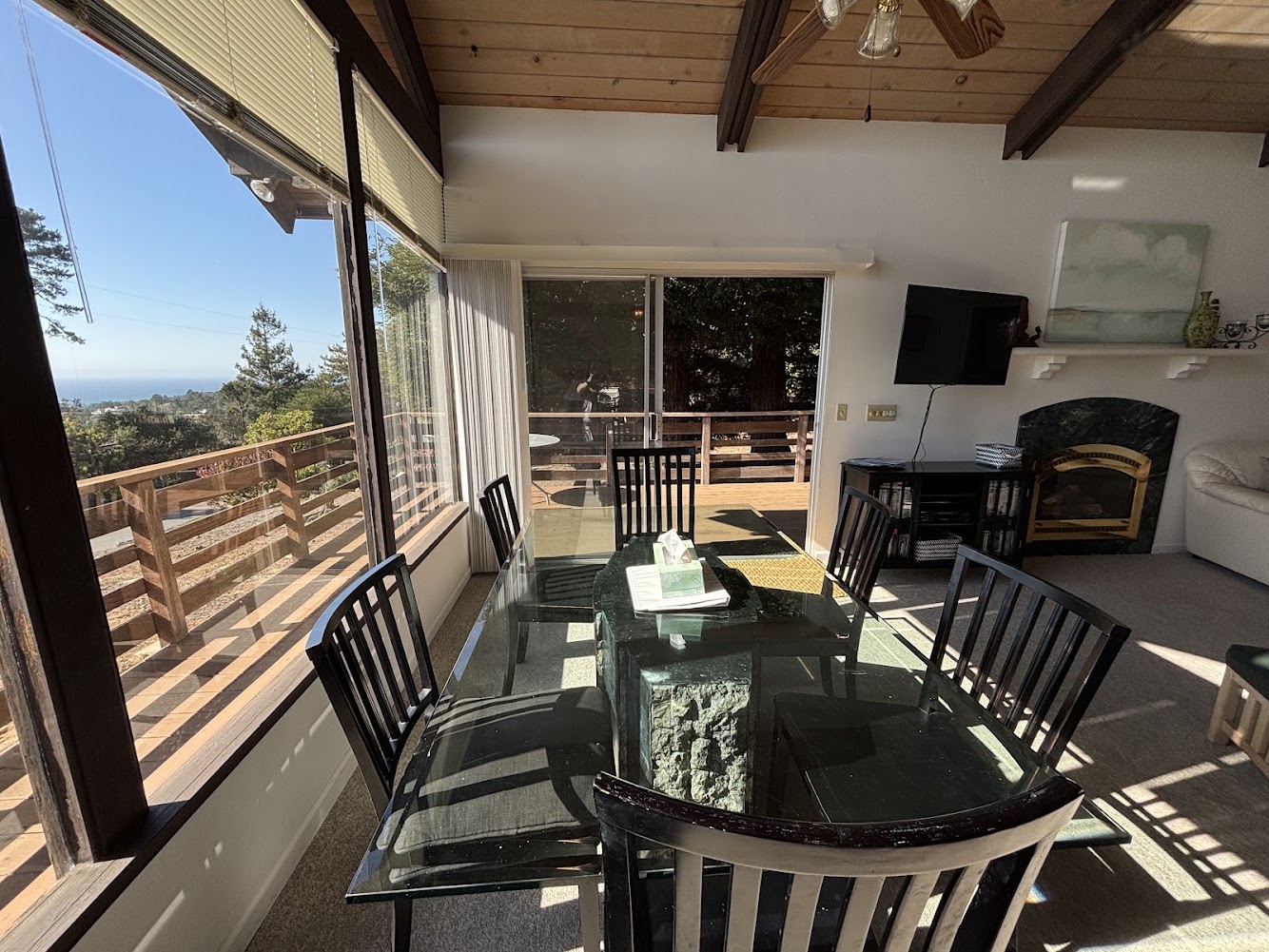 Dining area with ocean view and access to deck