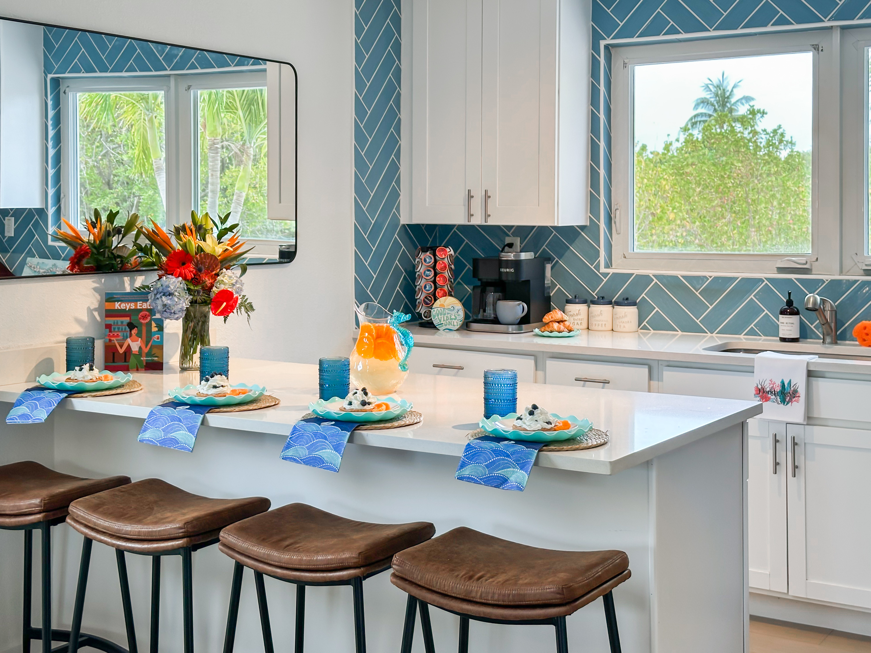 The kitchen island has additional 4 bar seats by the island.