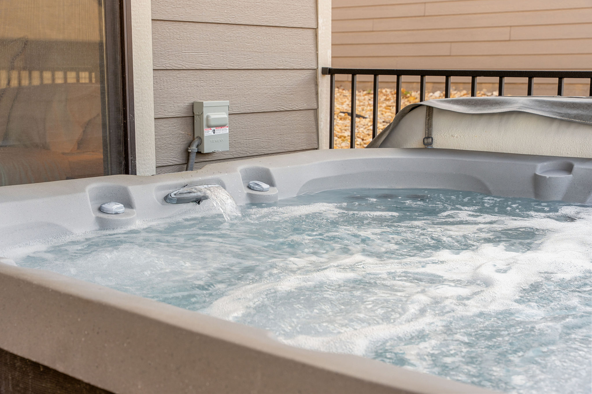 Relax in the private hot tub 