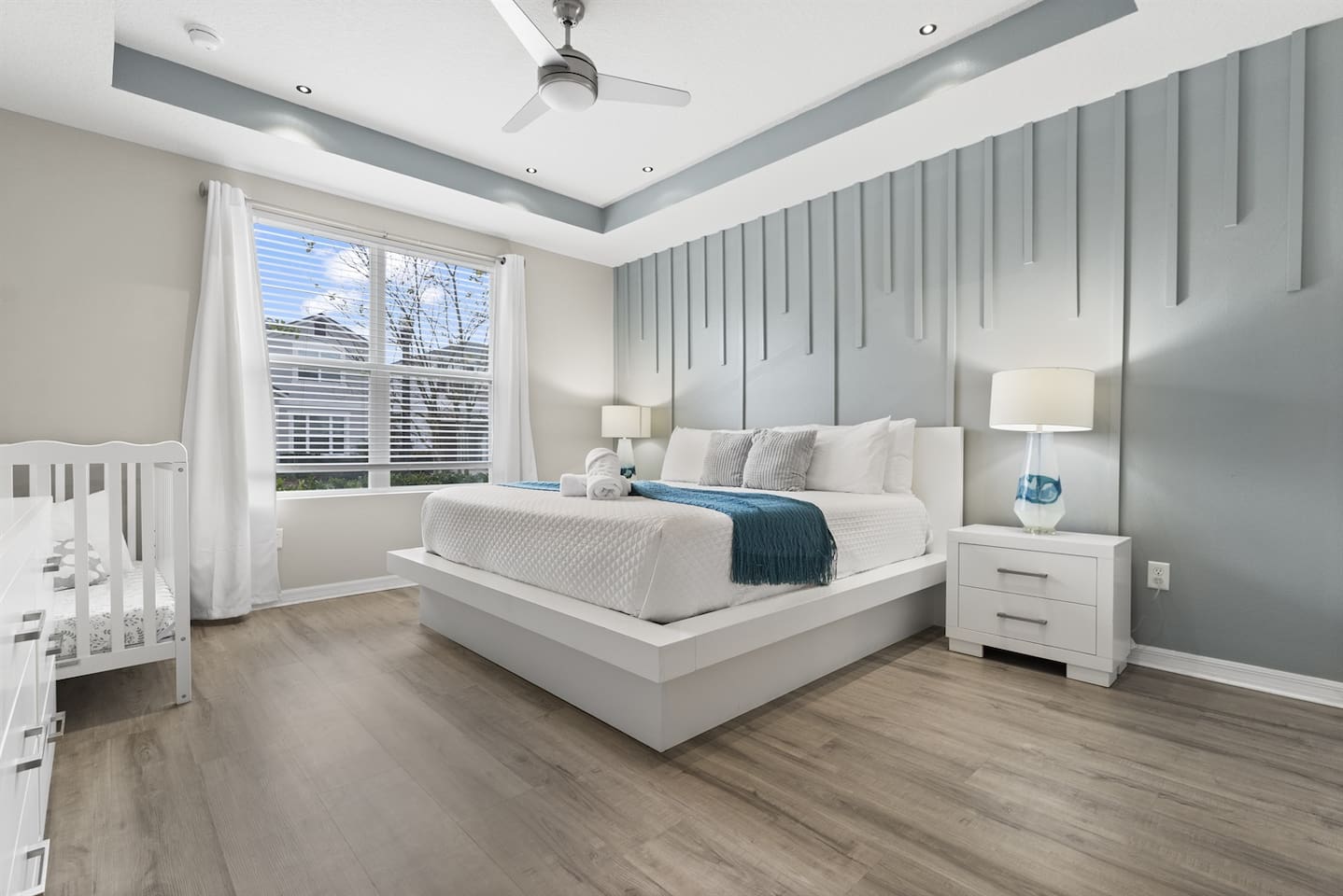 First Floor - This stunning king bedroom is perfect for families, featuring a cozy crib for your little one