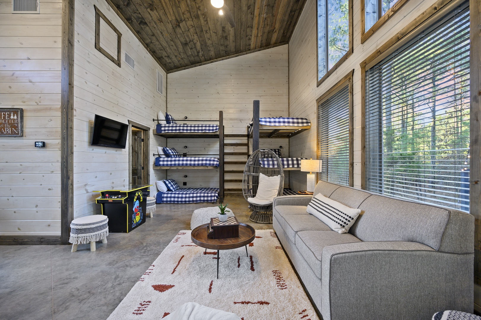 The bunkhouse is a favorite hangout spot with games, cozy seating, and plenty of space for kids and teens to unwind after a day of adventure.