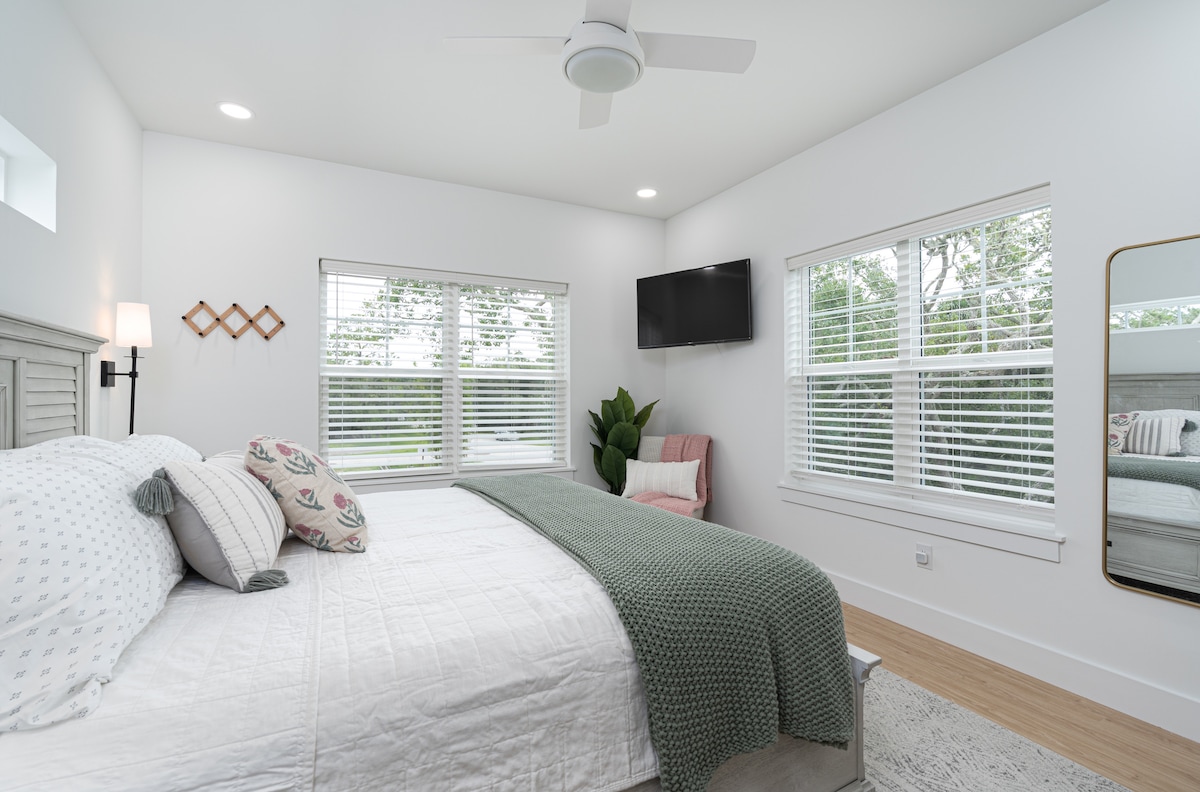 Wake up to oak branches outside both windows. Coffee comes upstairs, the TV stays off a while longer, and the rest of the house has not stirred yet - the quietest half hour of the whole week is right here.