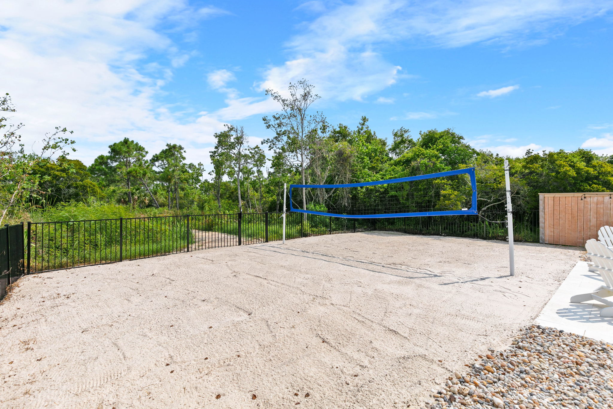 Your own sand volleyball court makes it easy to start a family game without leaving the property.