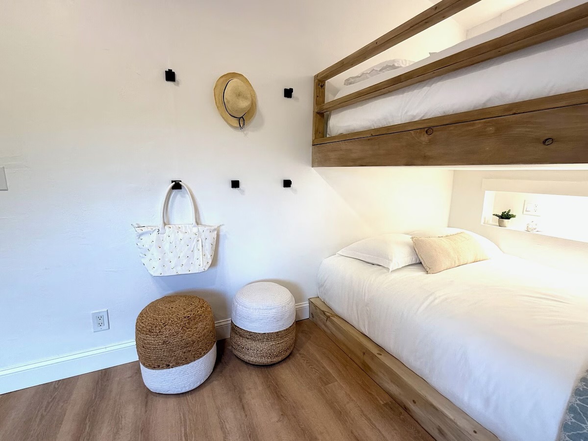Each bed has its own cozy space with a lit nook and shelf to charge electronics