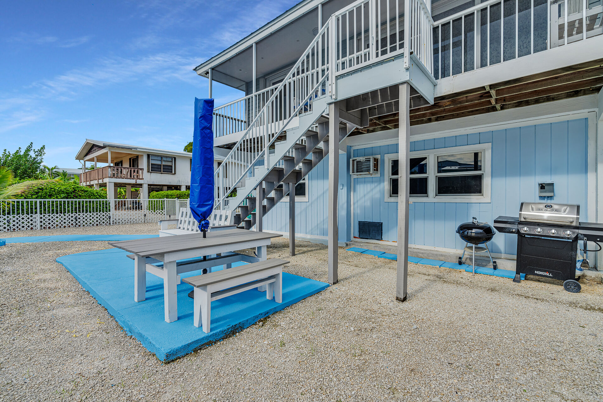 Outdoor dining area with propane and charcoal grills