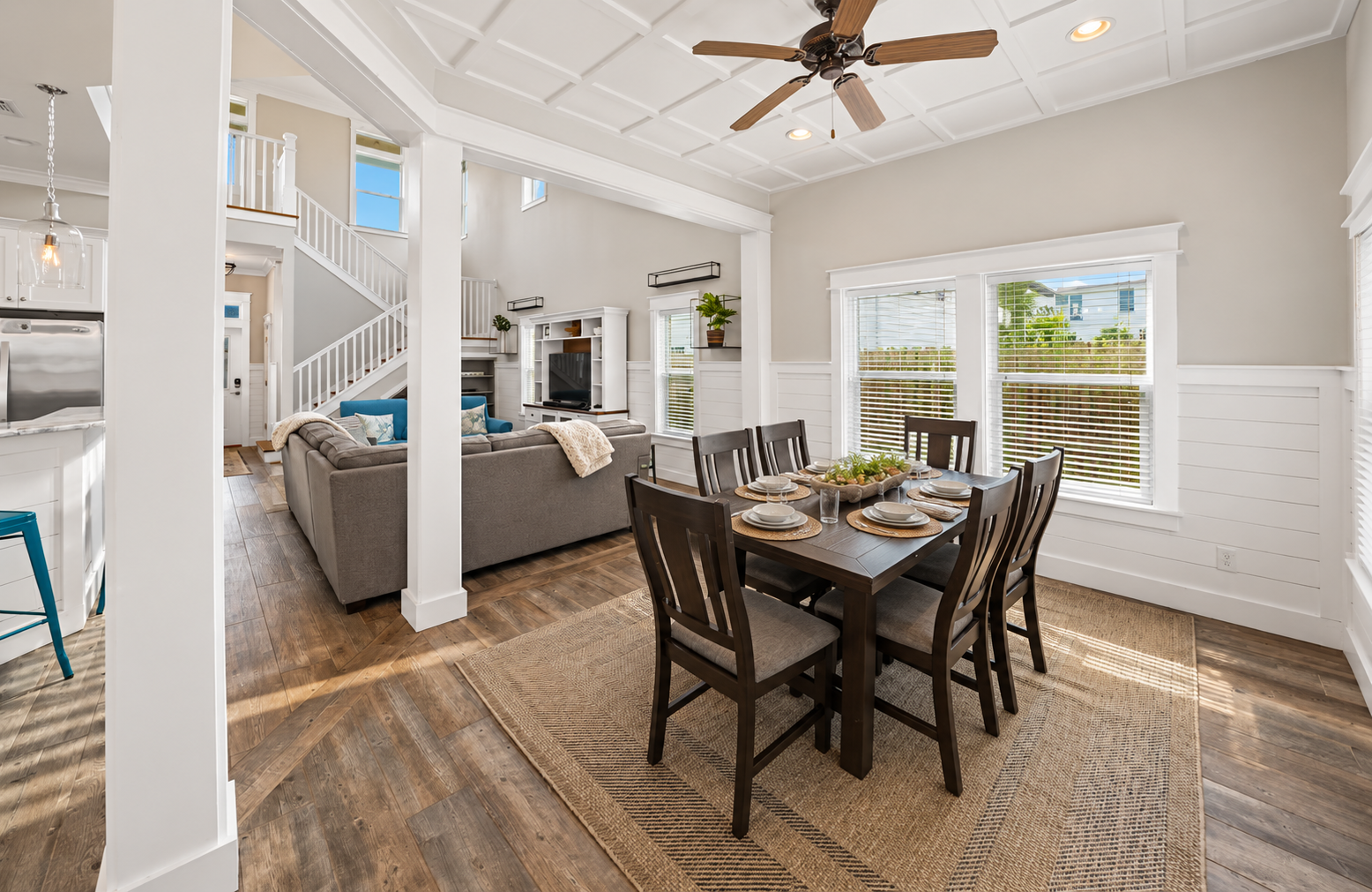 Relax and unwind in this spacious living room, featuring comfortable seating, coastal inspired décor, and plenty of room for the whole family.
