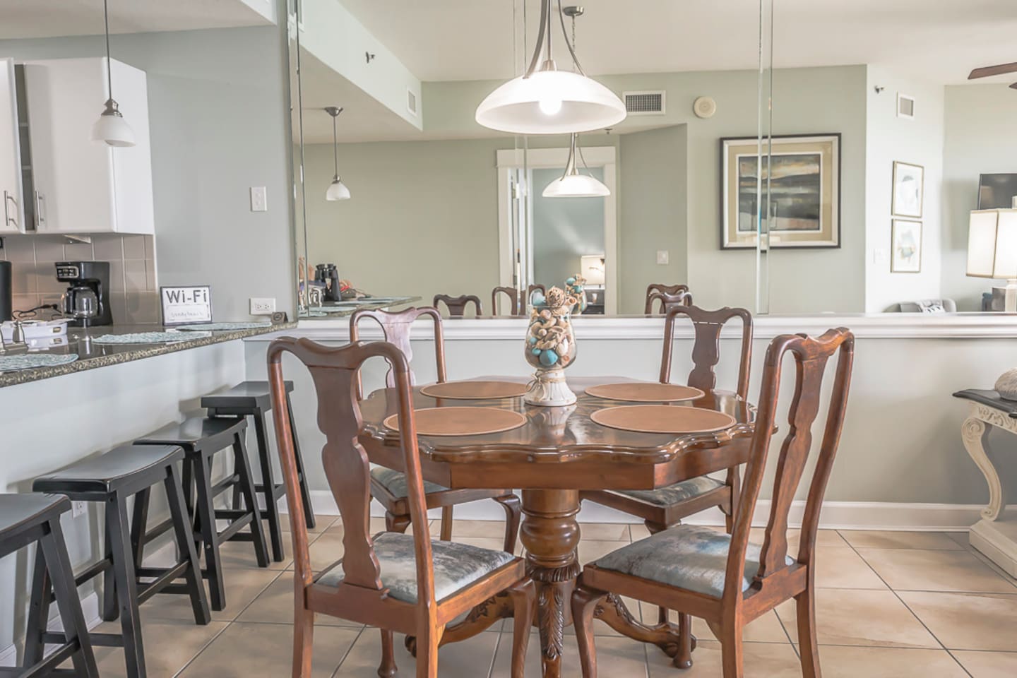Dining table sits 4 and seating for 4 at the bar