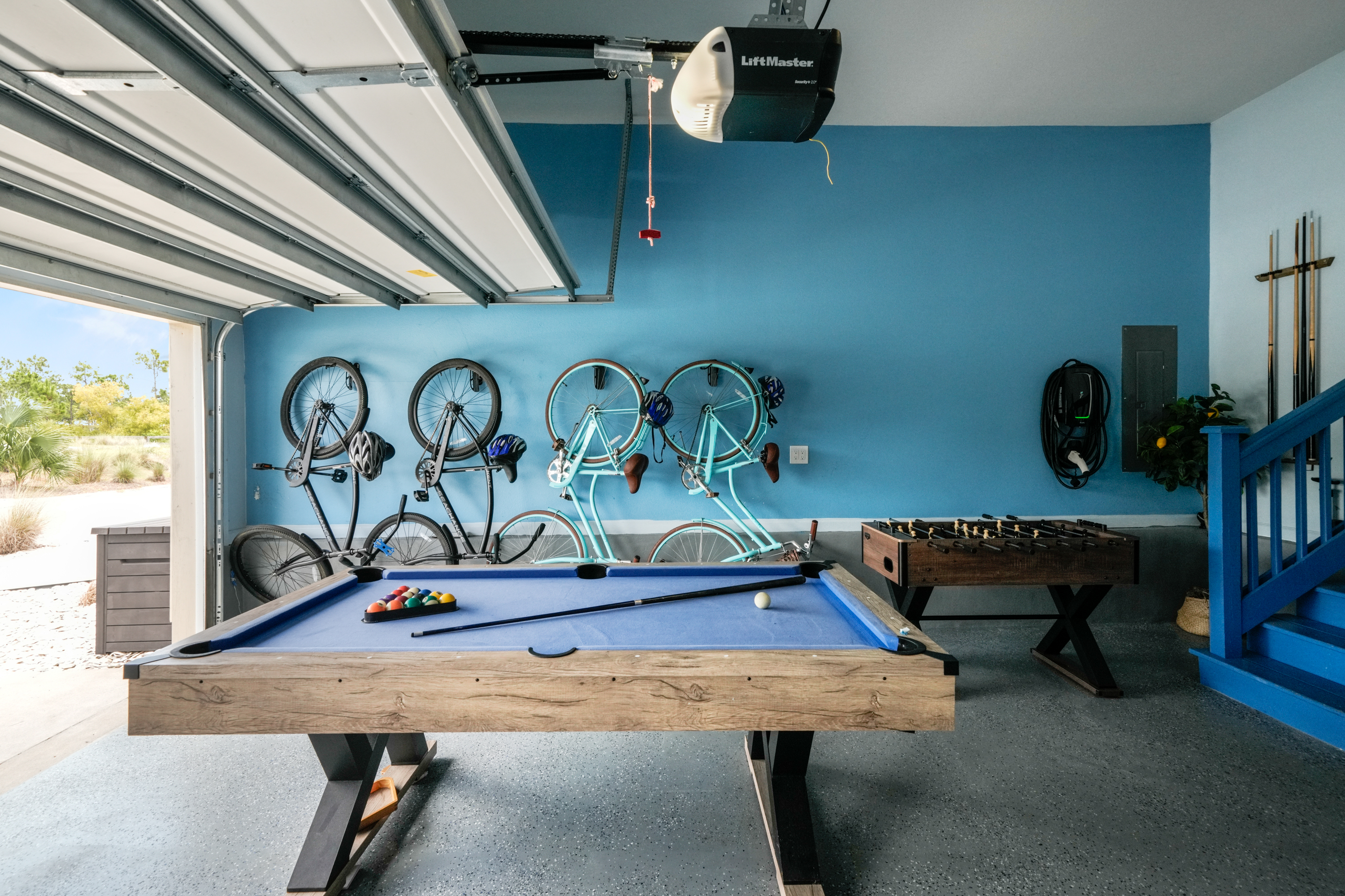 Enjoy friendly competition in the game room with a mini pool table, foosball & mini bar with Smart TV.