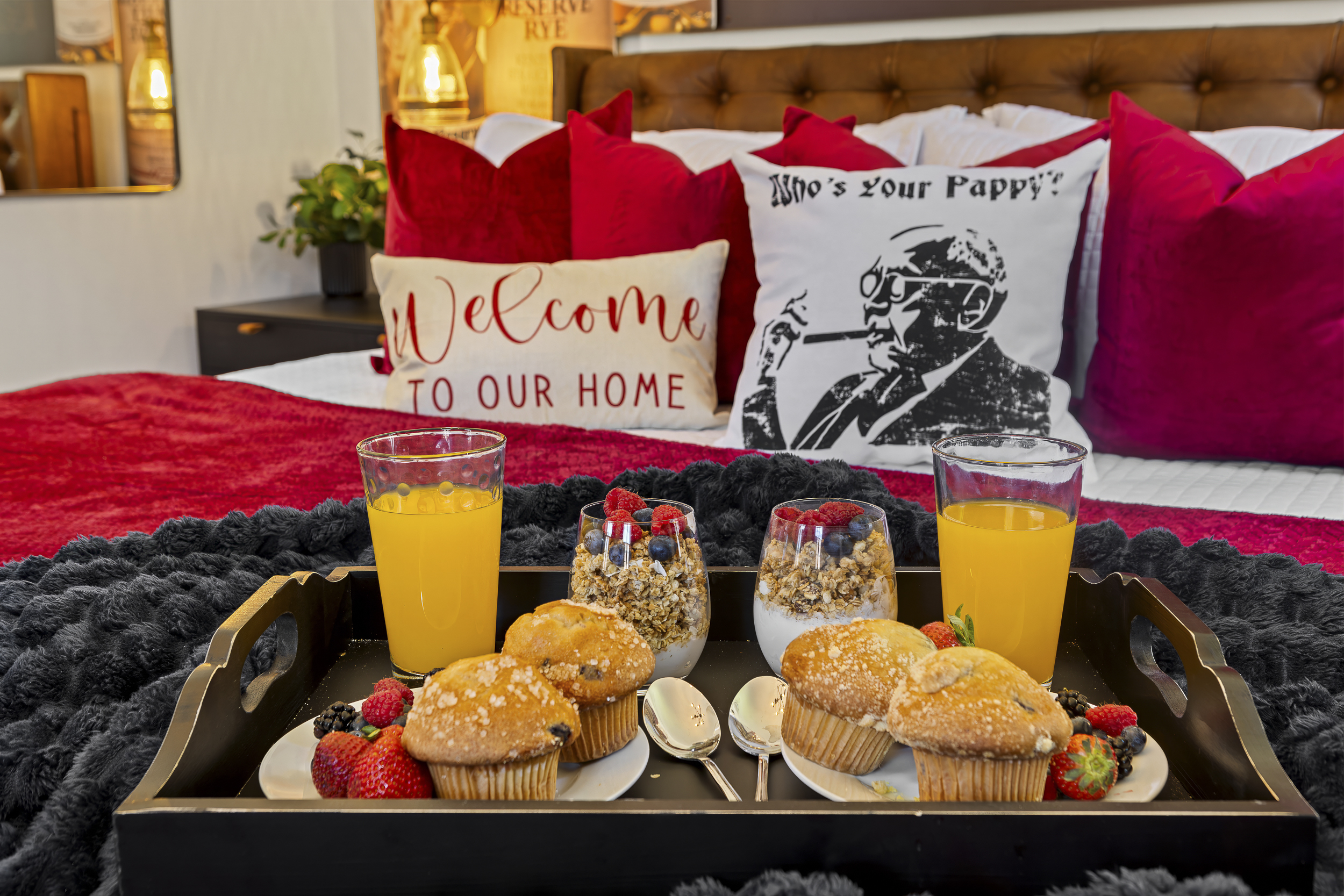 A “Who’s Your Pappy?” pillow, fresh muffins on the tray, and Van Winkle artwork throughout make this room a fitting tribute to its namesake.