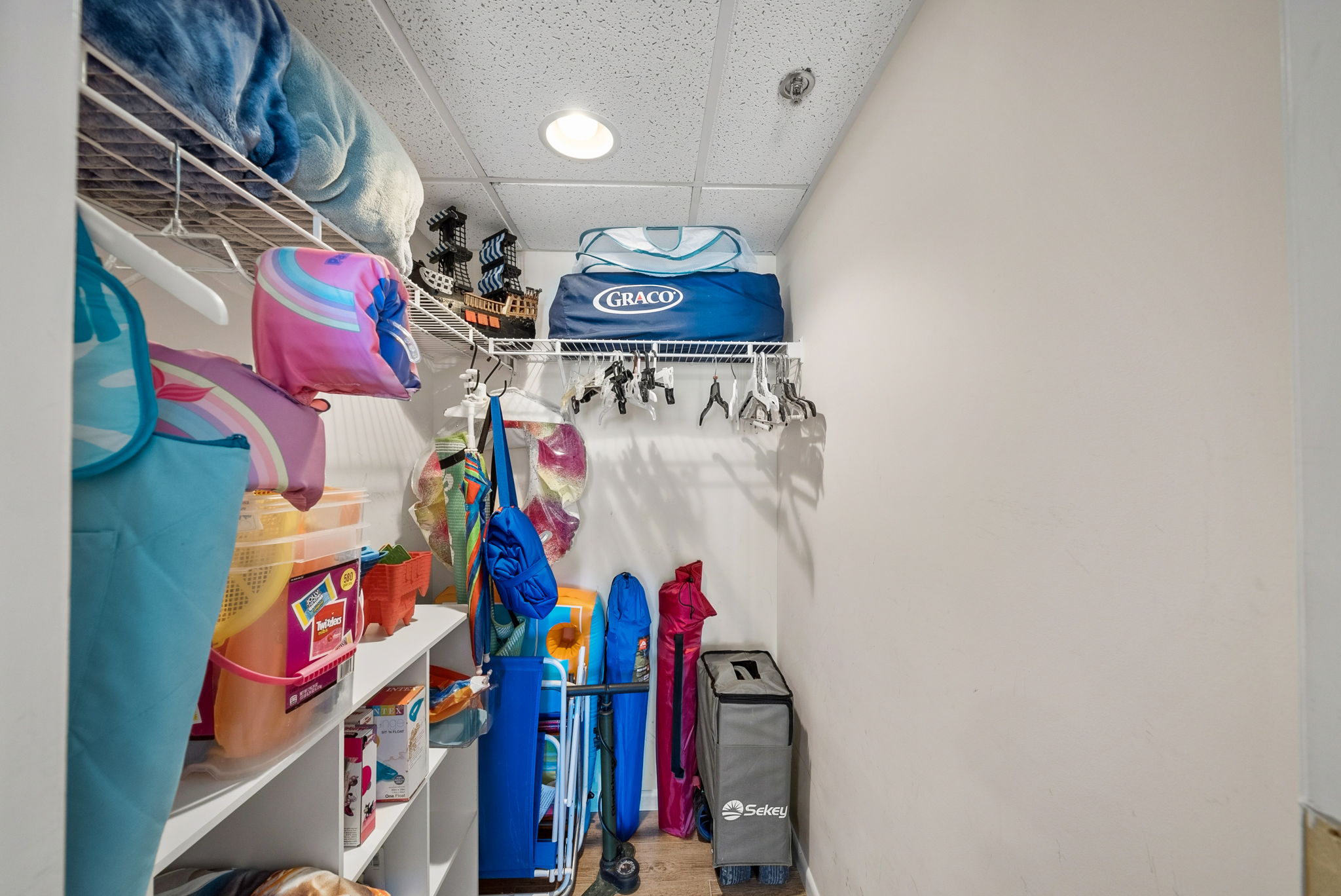 Closet full of beach gear and baby equipment for guest use, free of charge