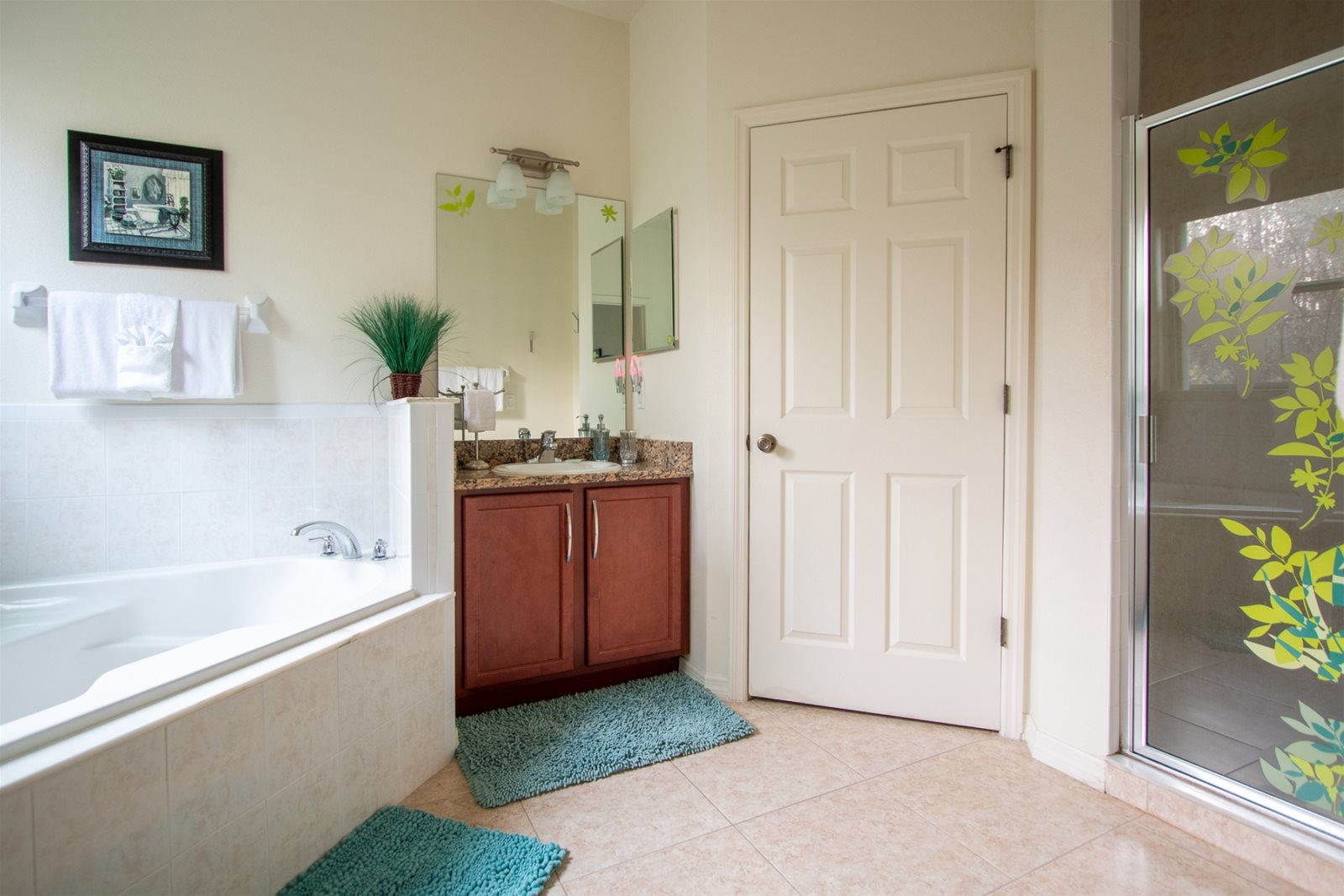 Master bath with two vanities, large soaking tub, shower