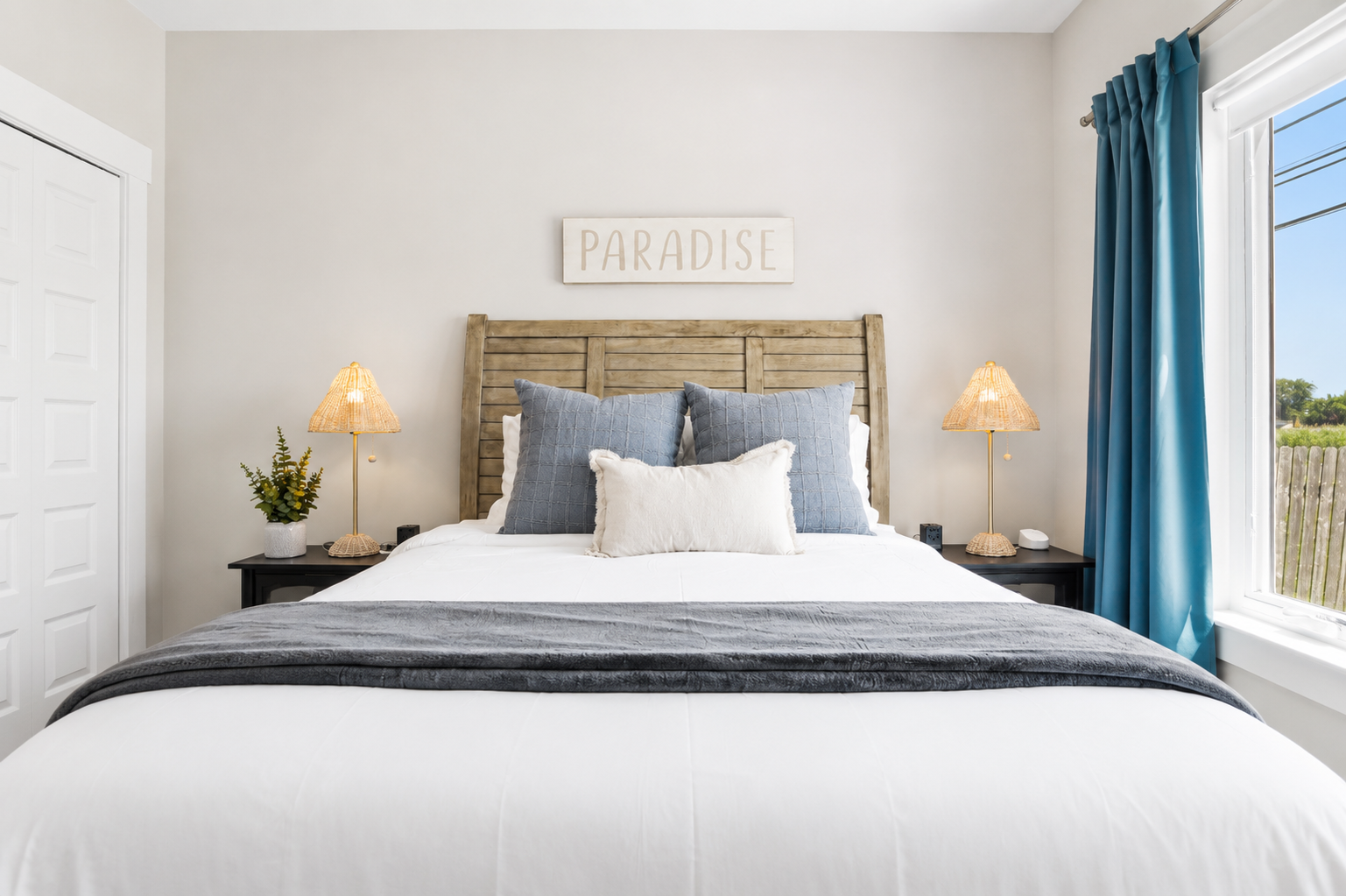 Wake up refreshed in a cozy retreat complete with a queen bed, blackout curtains, and roller shades for restful mornings after a day on Lake St. Clair.