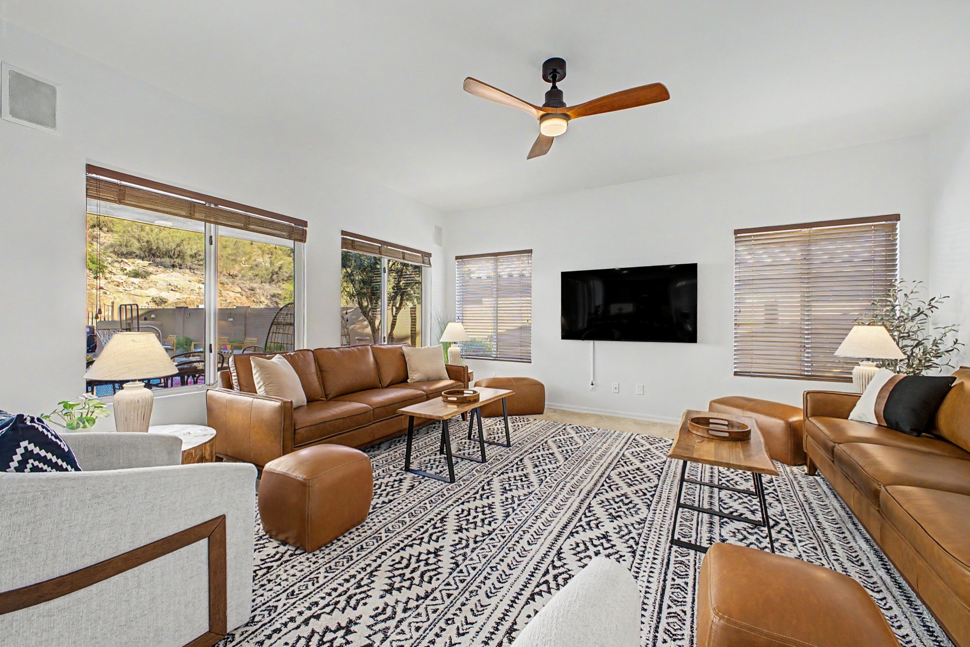 Living Room: Bright and airy space with sleek furnishings and stunning mountain views and 65" smart TV