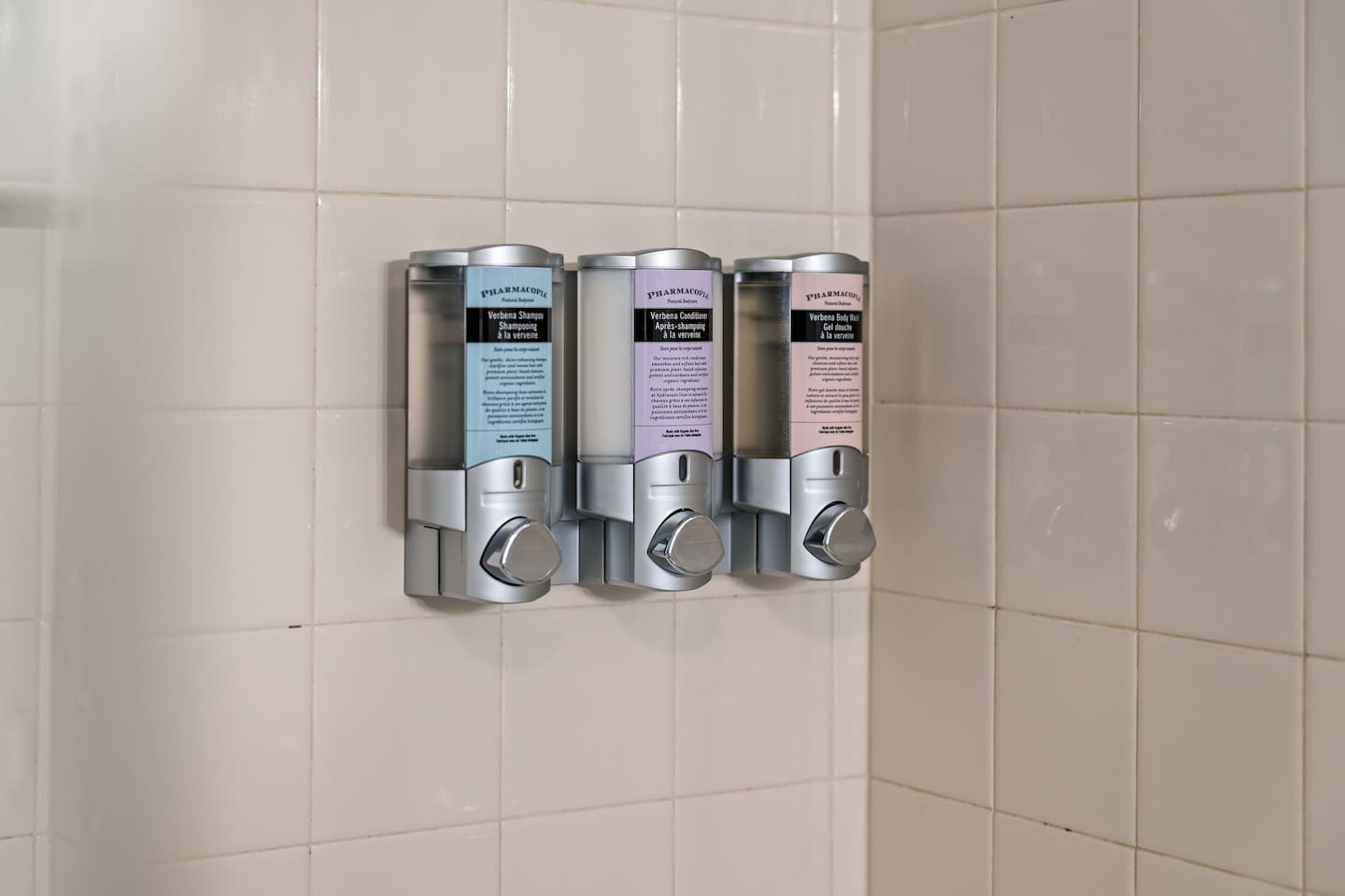 Pharmacopia Verbena bath amenities are provided from locked dispensers.  