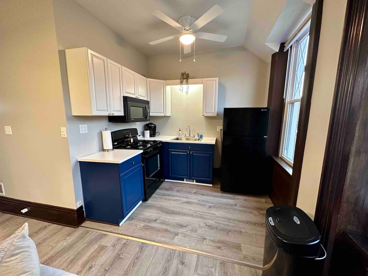 Bright and functional kitchen with a clean, open layout, offering a full range of appliances and plenty of counter space for meal prep.
