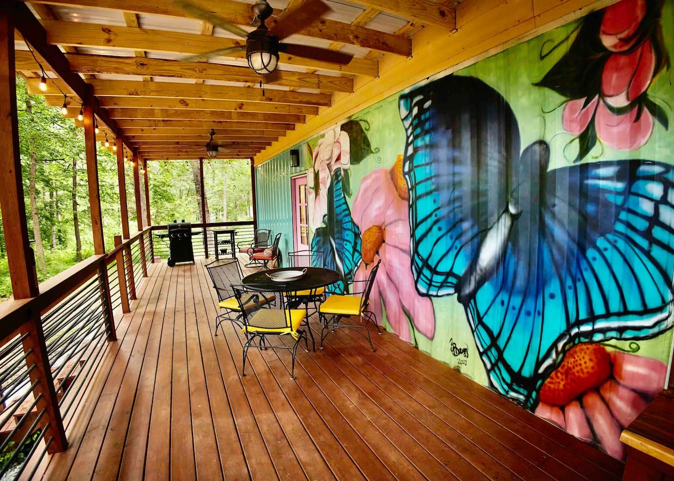 400 square feet of covered deck with outdoor furniture, gas grill, and prep space.  
