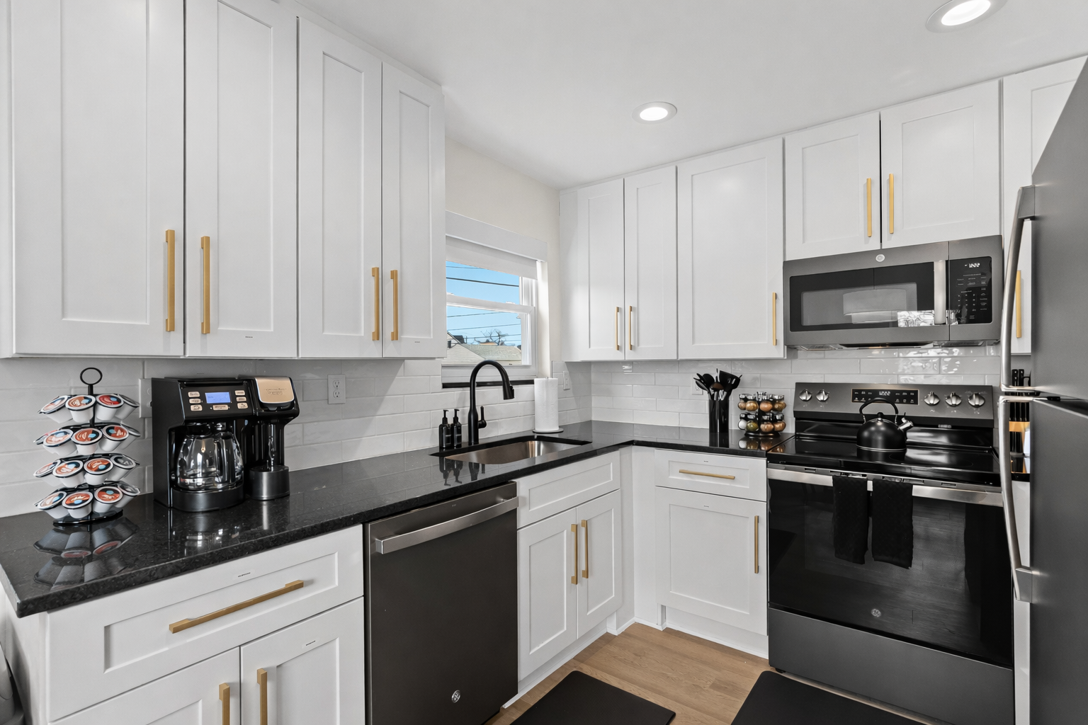 Bright, modern kitchen with full-size appliances, ample storage, and clean finishes—perfect for preparing meals and enjoying your stay with ease.
