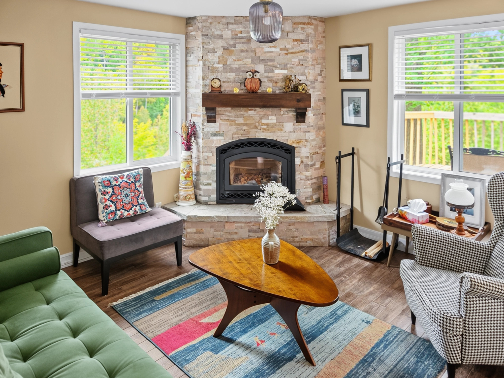 Living room seating area with wood-burning fireplace