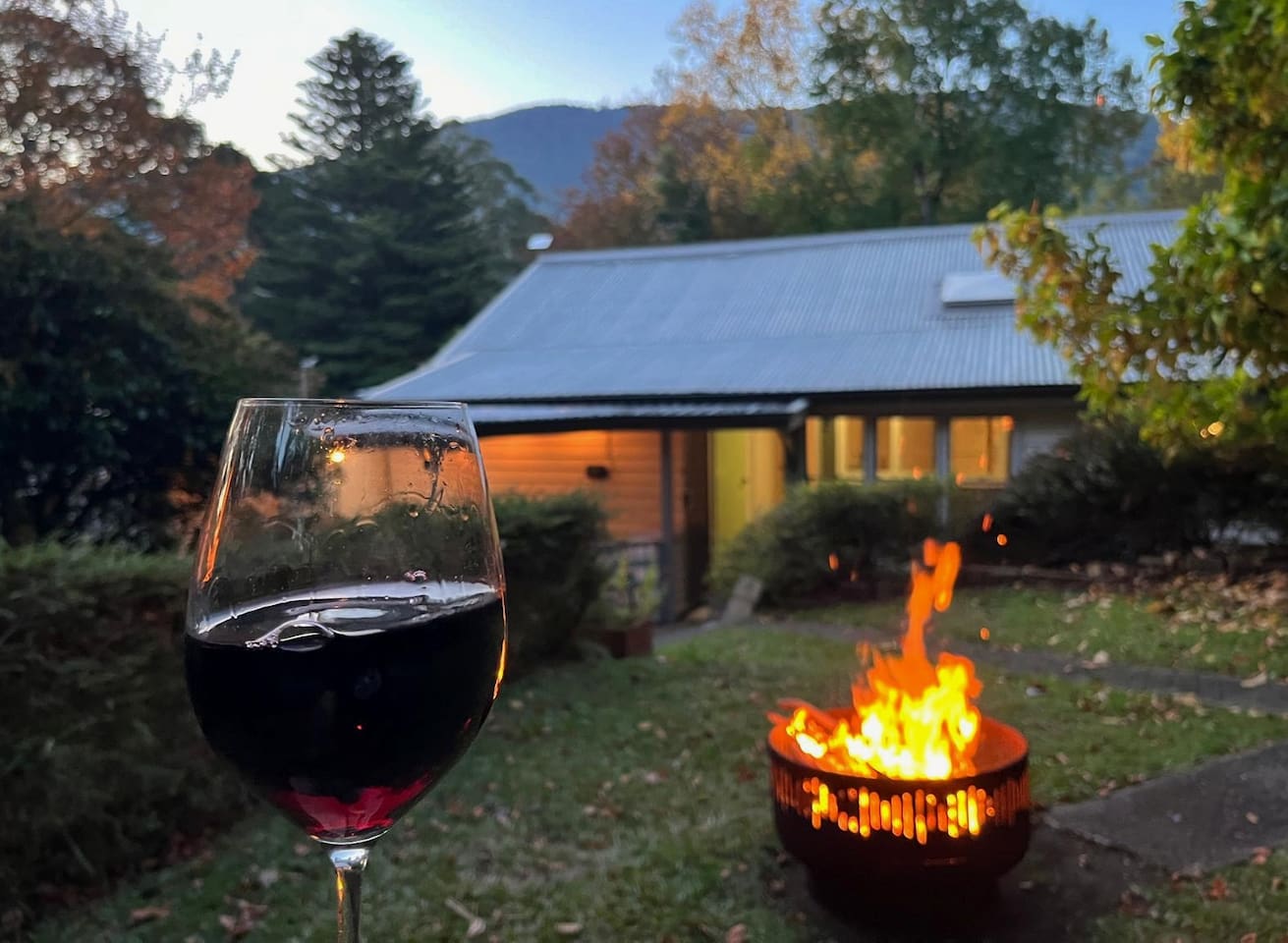 The fully fenced yard is immense. There is a garden in the front, facing Donna Buang, which you can also see from this pic  - this is the fire pit area in the back. Further in the very back is a large yard and lawns. There is also a covered deck/BBQ.