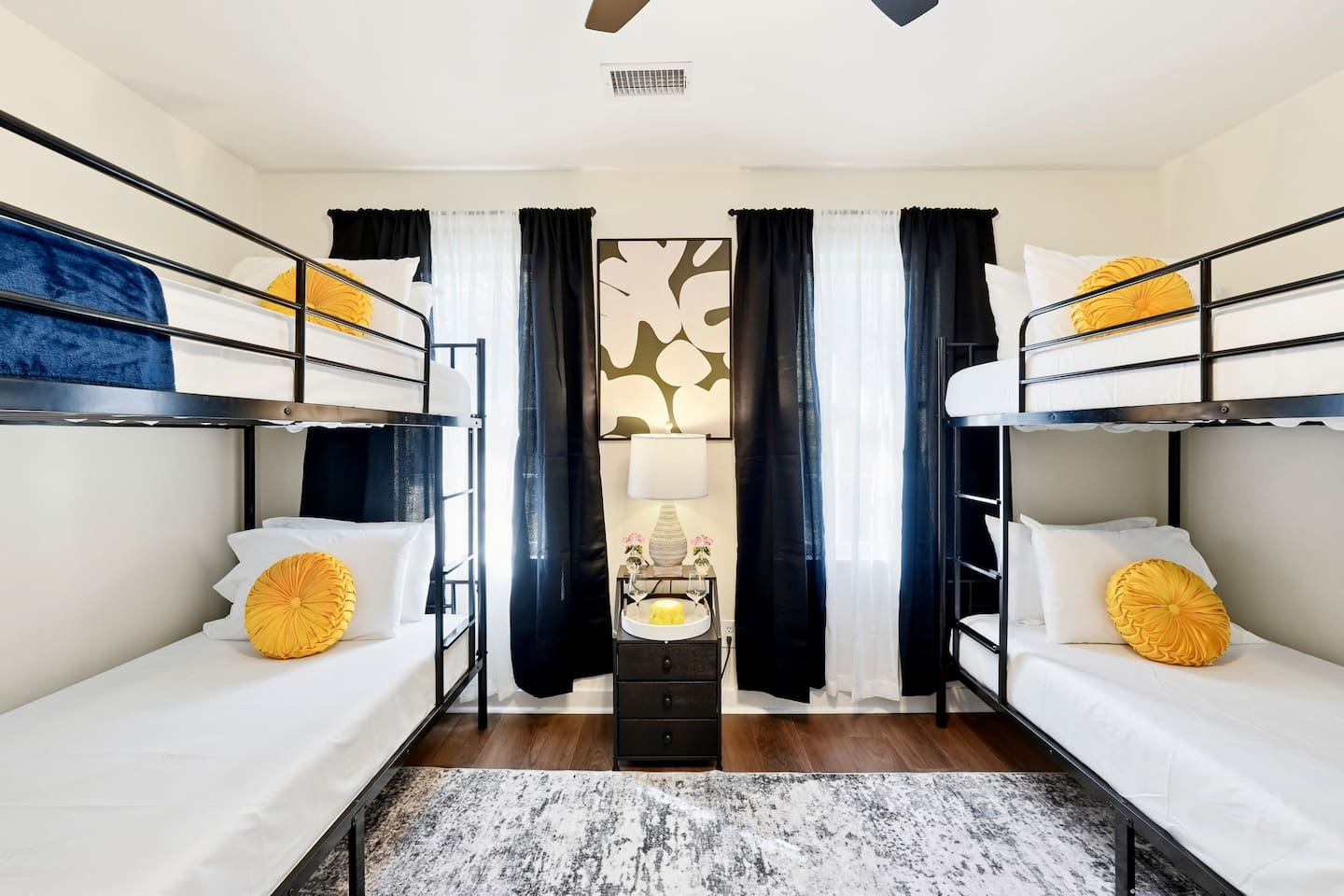 Cozy second-level bedroom with two bunk beds, each with blankets and a Roku TV. First room you see at the top of the stairs. Includes 4 full-body towels, 4 washcloths, and 2 hand towels for your stay.