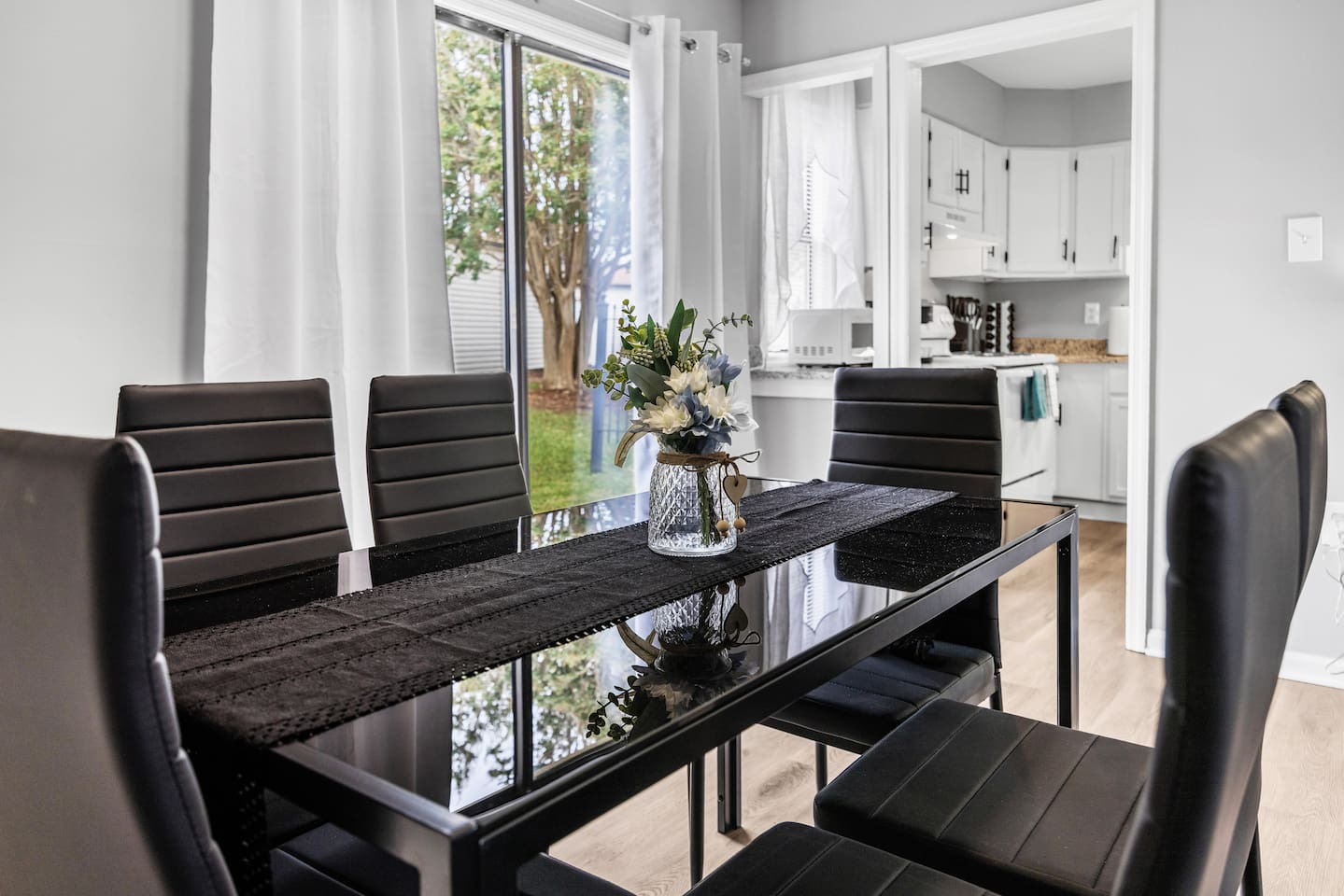 Sliding glass doors offer plenty of natural light and easy access to the backyard.