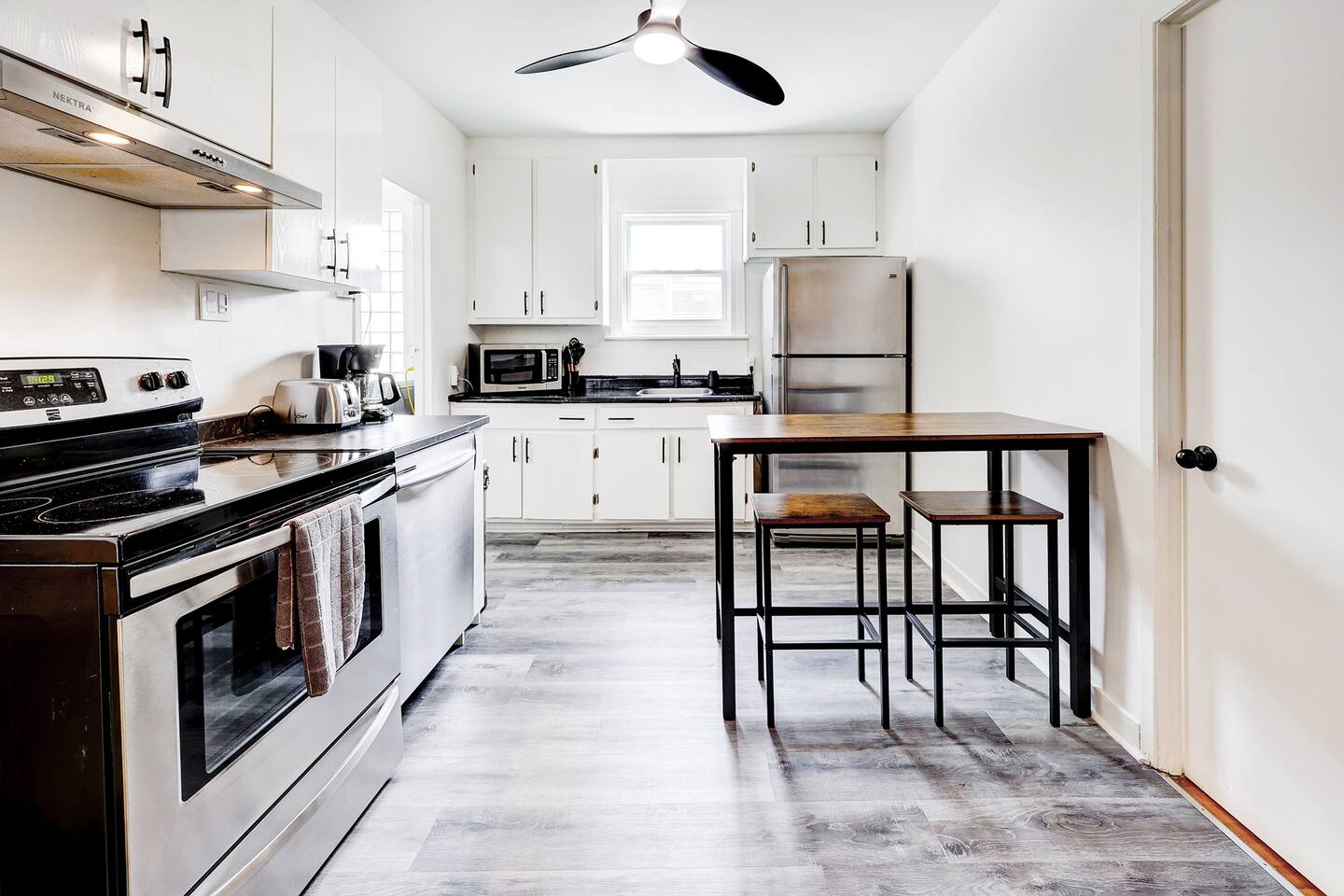 A stylish kitchenette made for simple and convenient living.