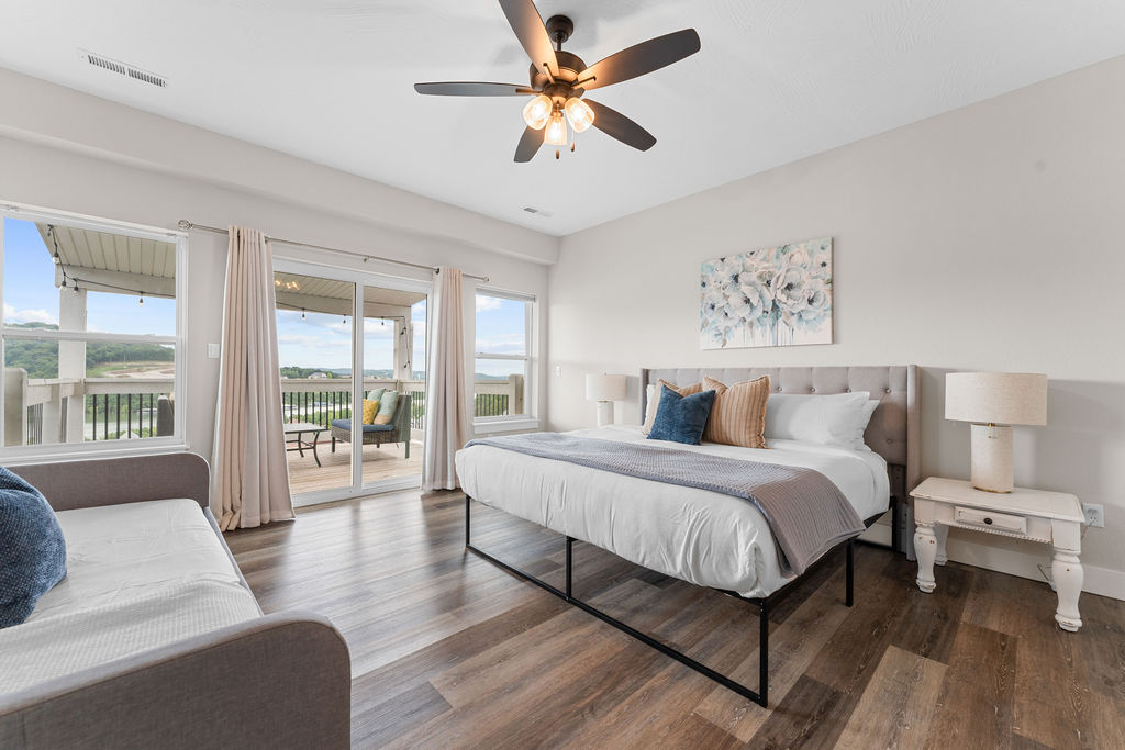 Upper level King bedroom w/ ensuite bath, daybed with trundle, and deck access