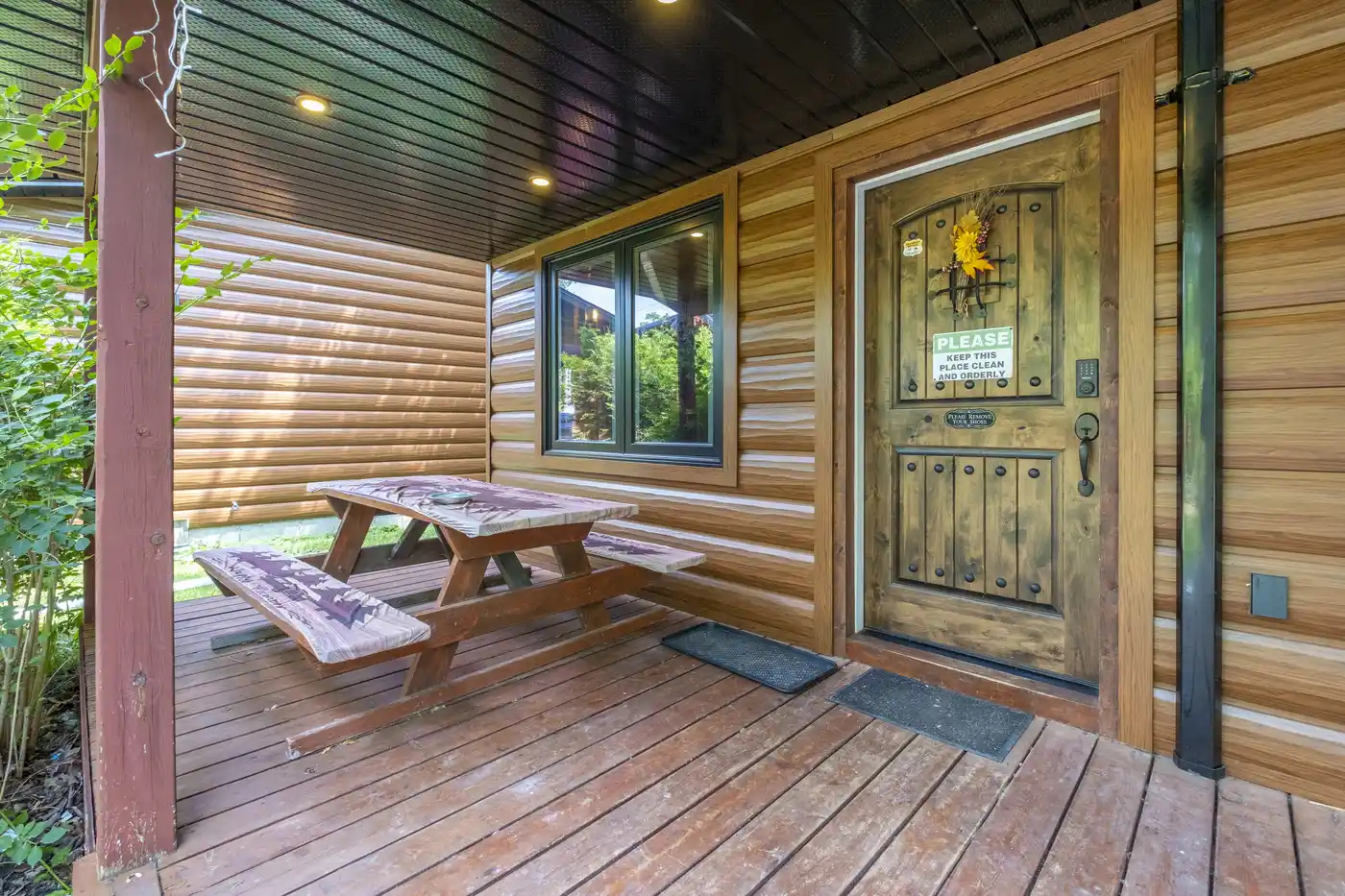 Covered porch with picnic table and private outdoor seating