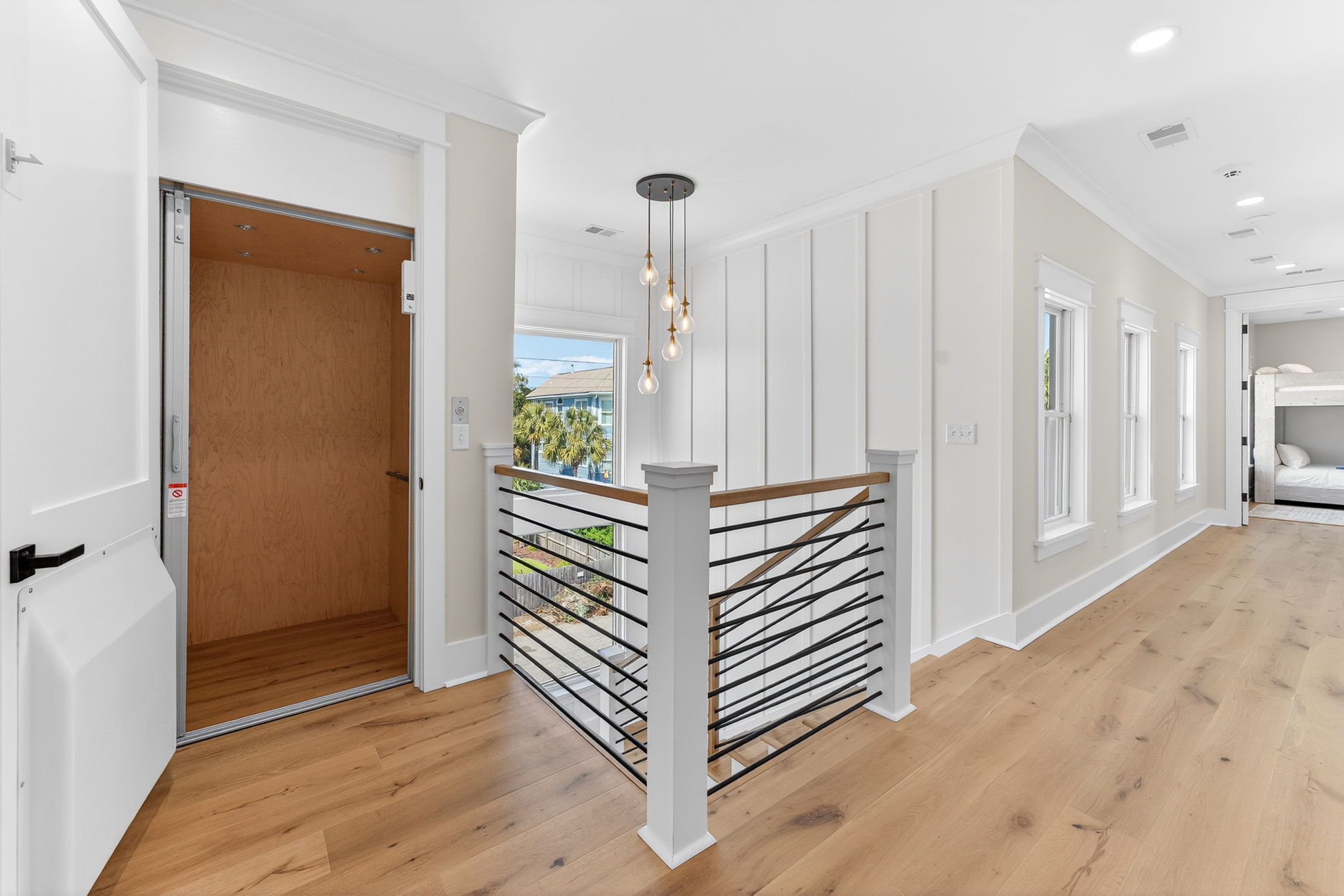 Elevator on 2nd Floor Landing | On Beach Time | 6 30th Ave, Isle of Palms, SC | IOP Escapes