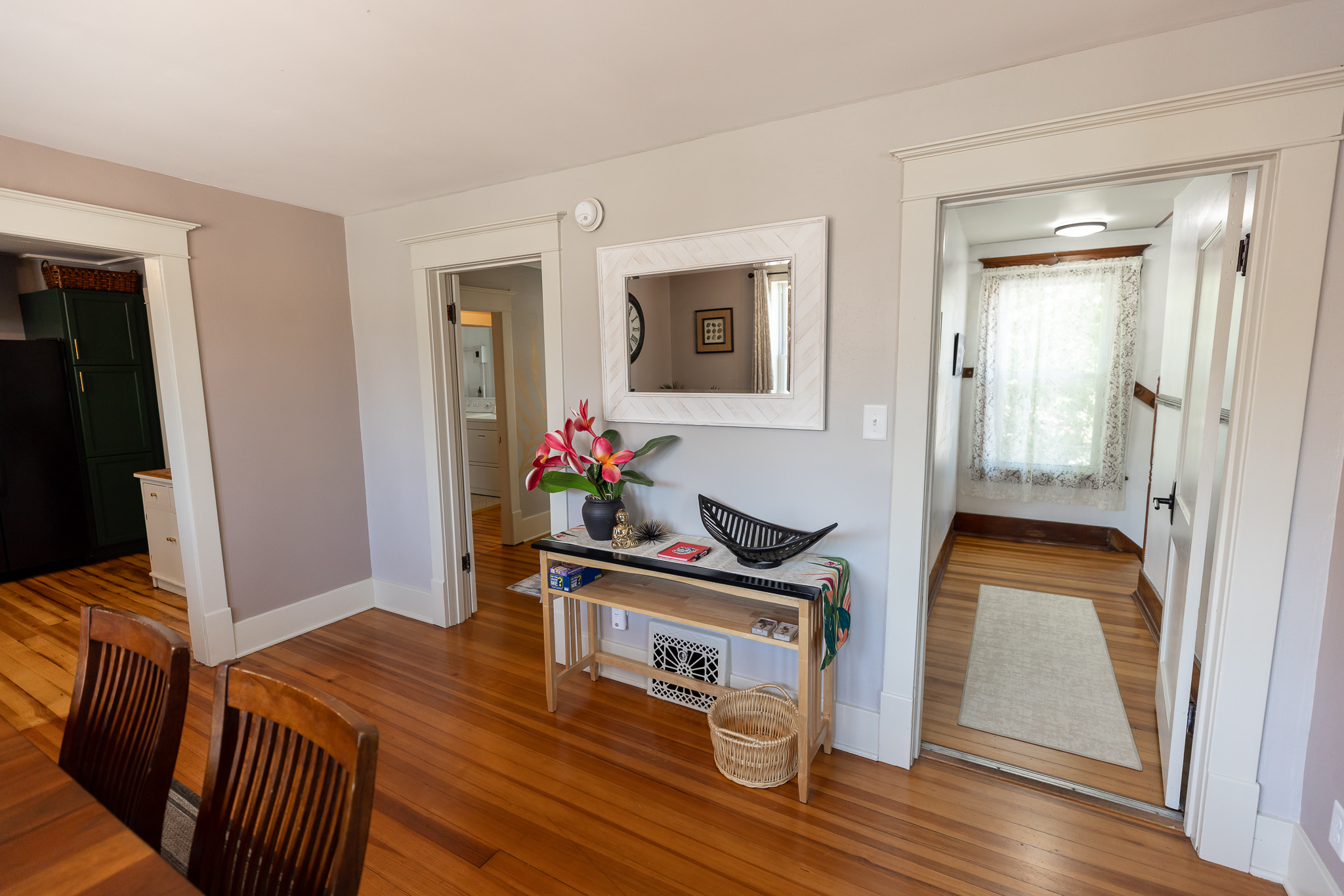 The entry hallway has plenty of room to store your shoes.  When the heat or air is on, closing the door helps regulate the temperature, but when the windows are open, the air flows across
