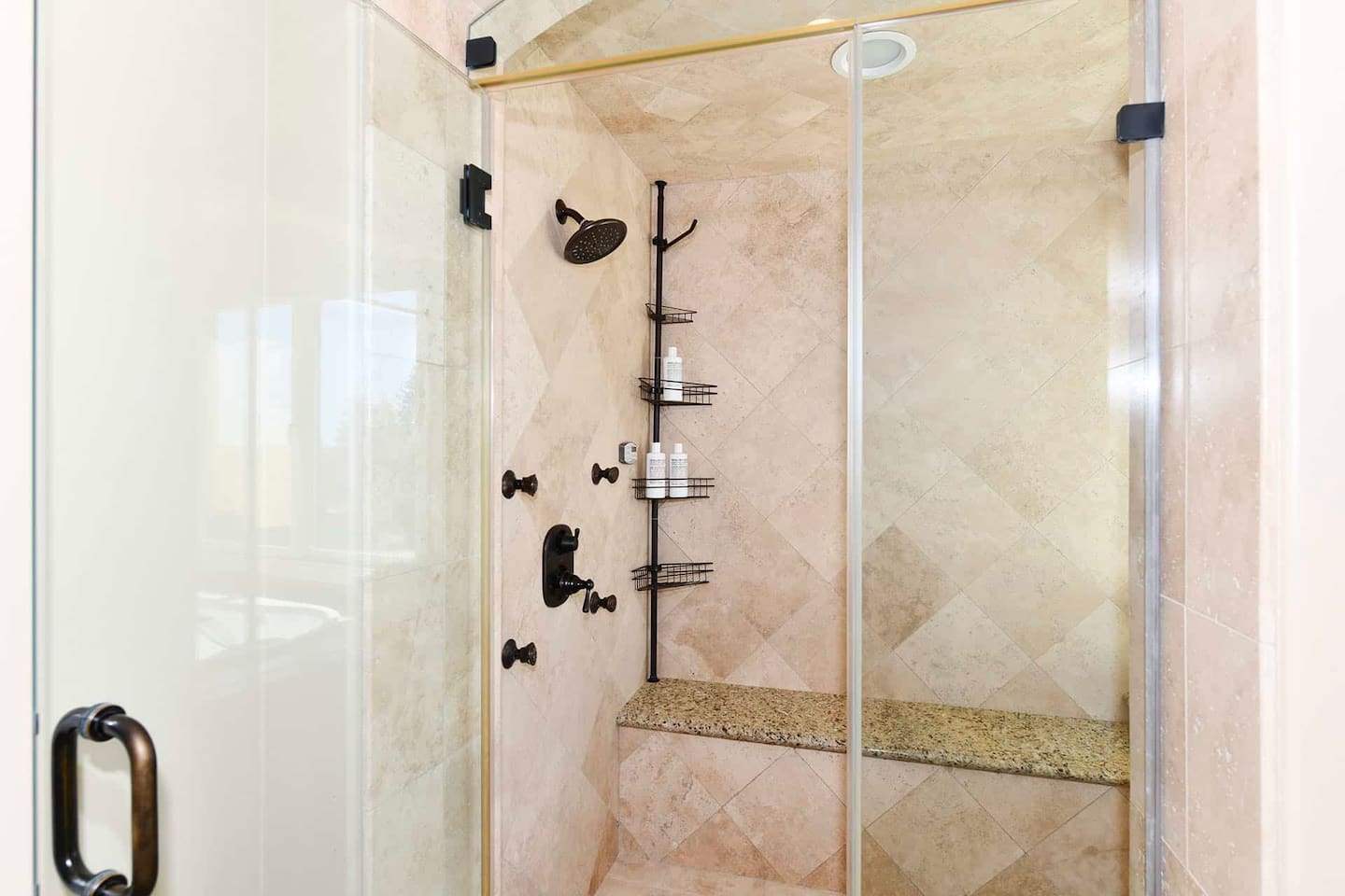 Primary bathroom with jacuzzi and shower.