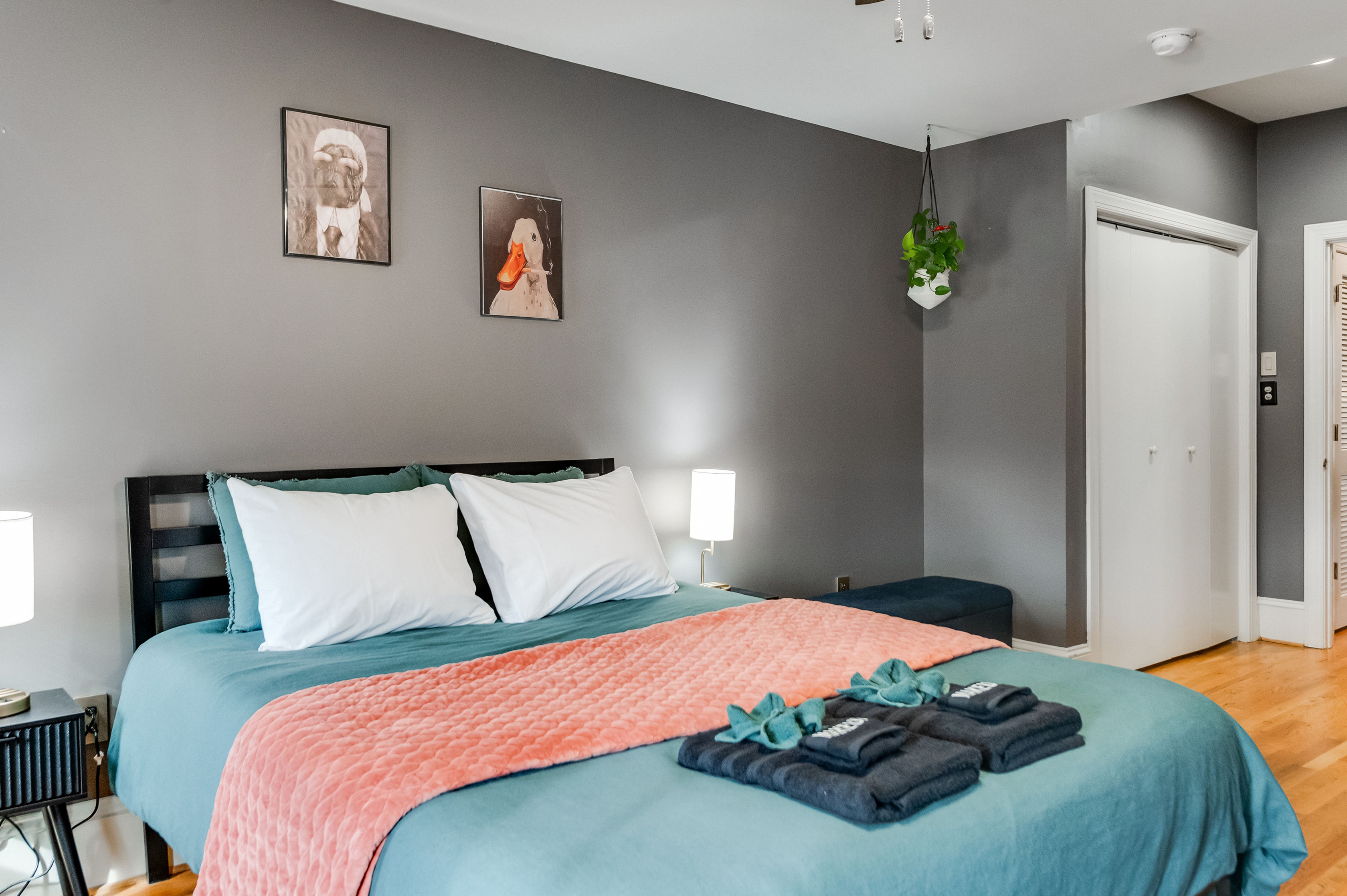 Queen Bedroom 3: Vibrant decor, plush bedding, and eclectic art for a playful, restful escape!