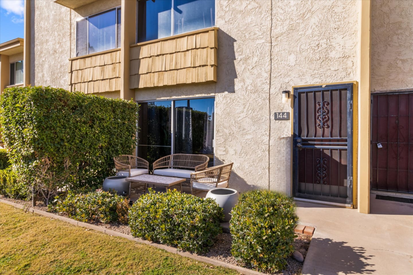 Front patio with outdoor seating, a small table, and easy access to the property
