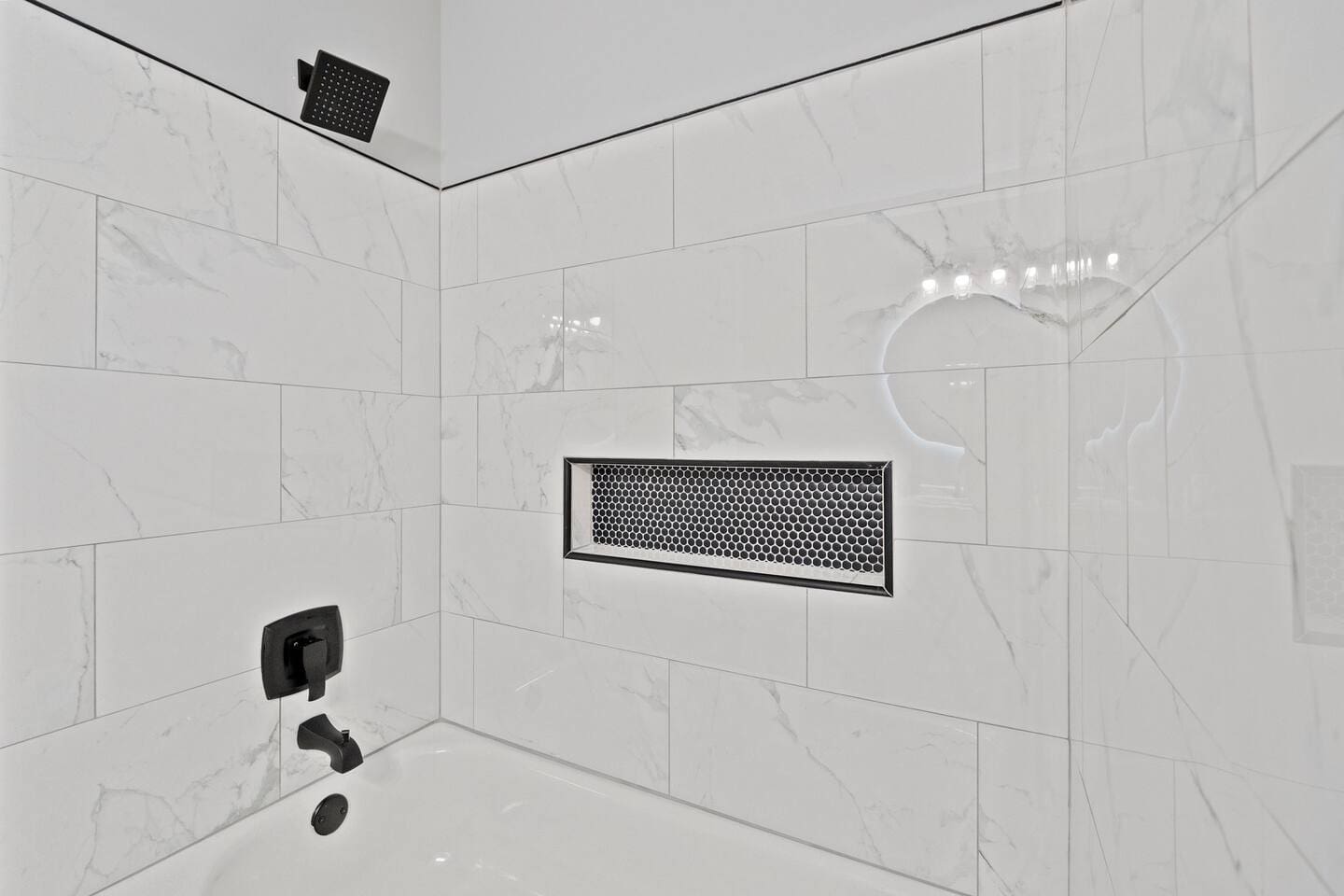 Spacious full bathroom equipped with both a shower and a relaxing tub, providing the perfect space for comfort and convenience.