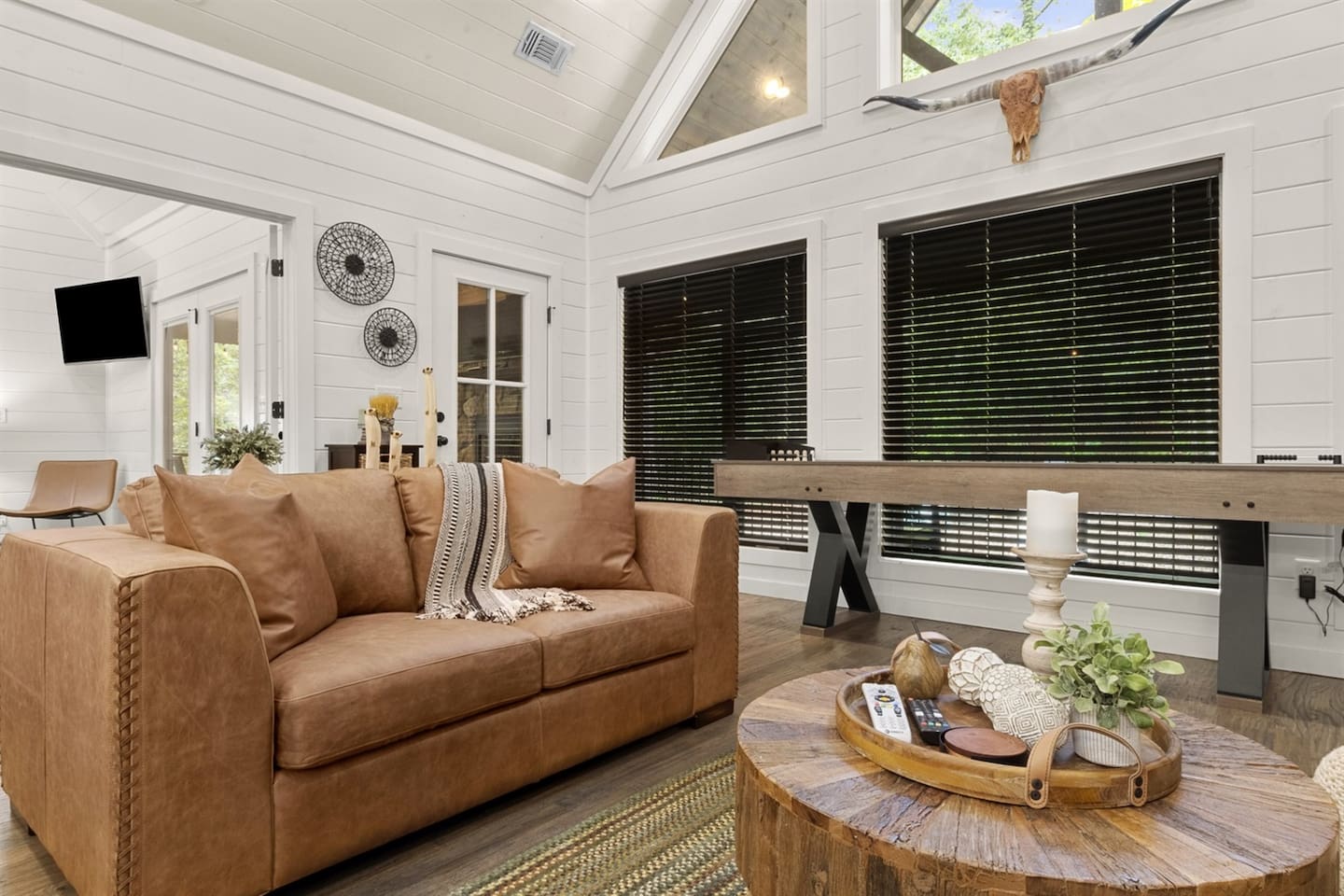 Comfortable seating, a welcoming atmosphere, and stylish décor make this living room the heart of Rabbit Paw.