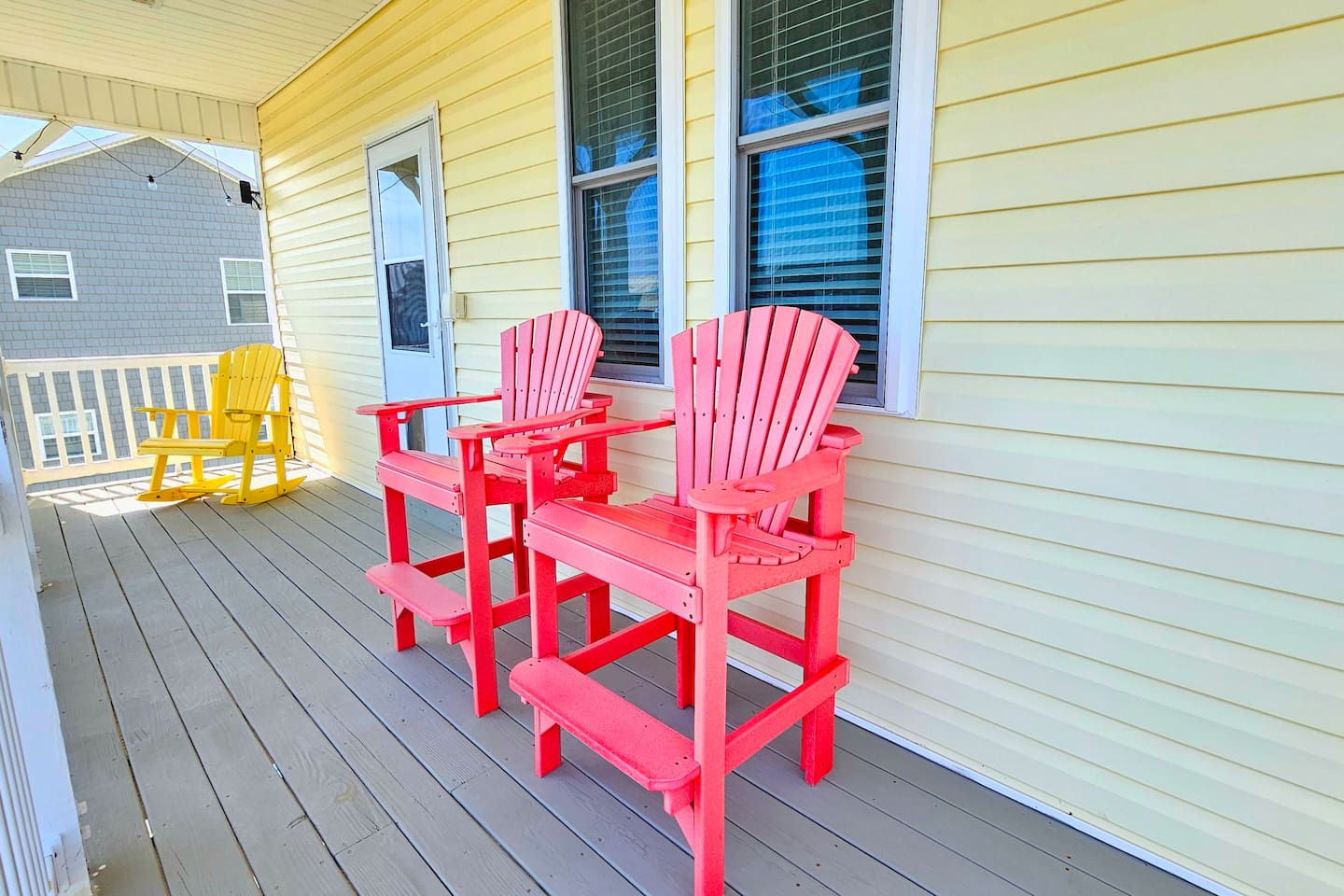 top front balcony facing the ocean. this is upstairs off of the kitchen/dining/living room area