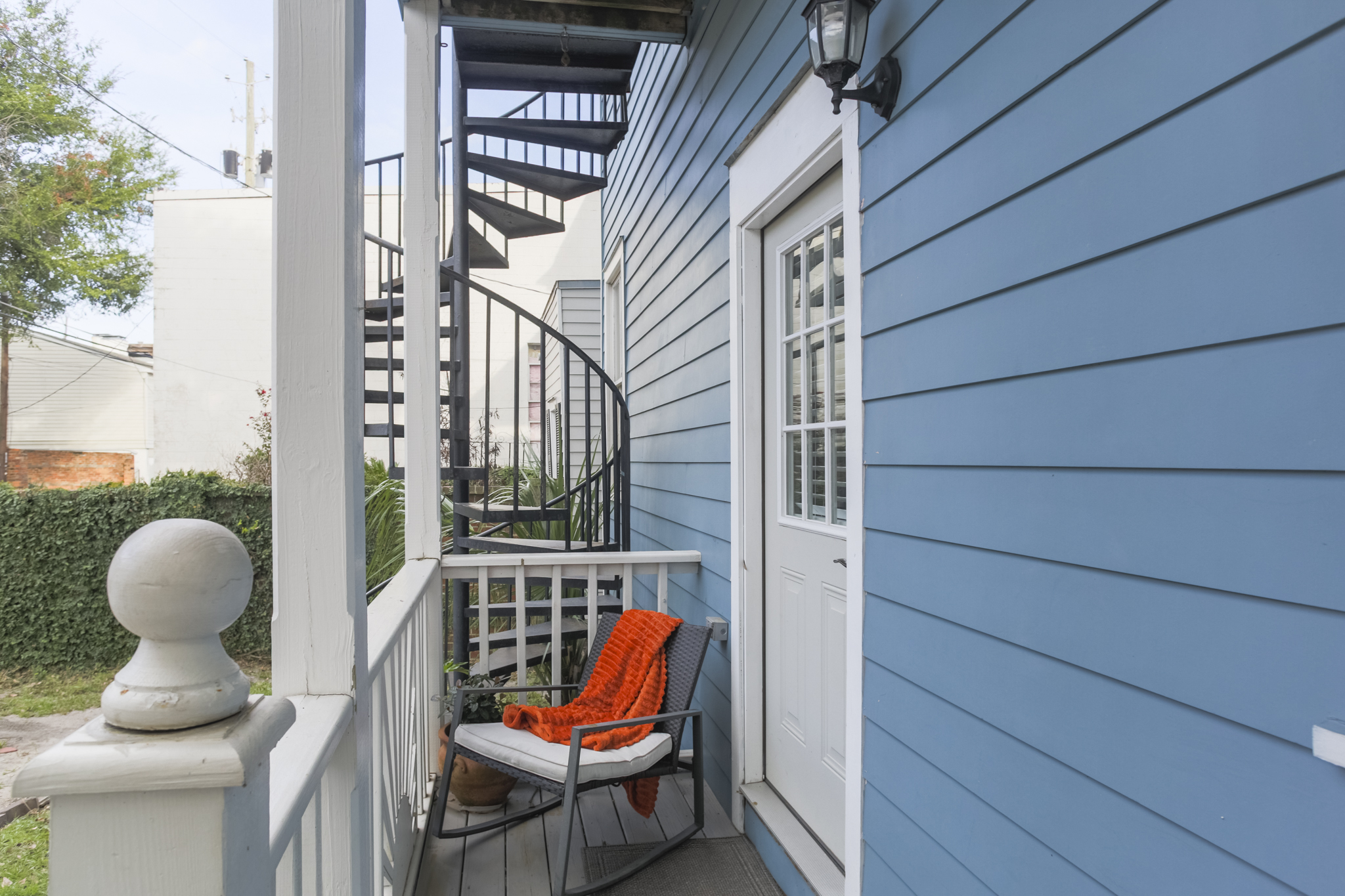Step out to the quaint back porch—perfect for a quiet moment with your morning coffee