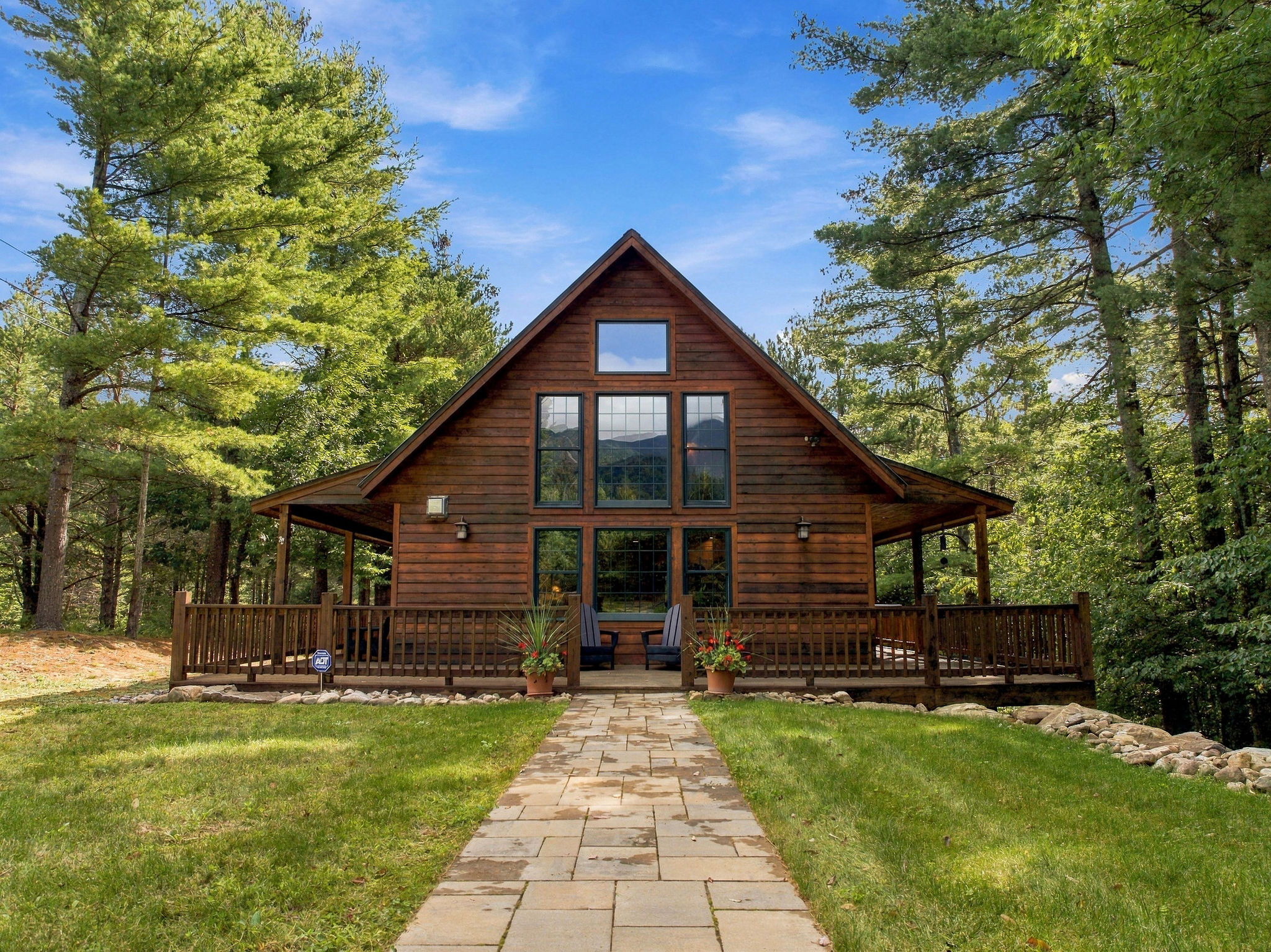 Welcome to Whiteface View Lodge, a private Adirondack retreat with incredible views of Whiteface Mountain. (Note the reflection in the windows)
