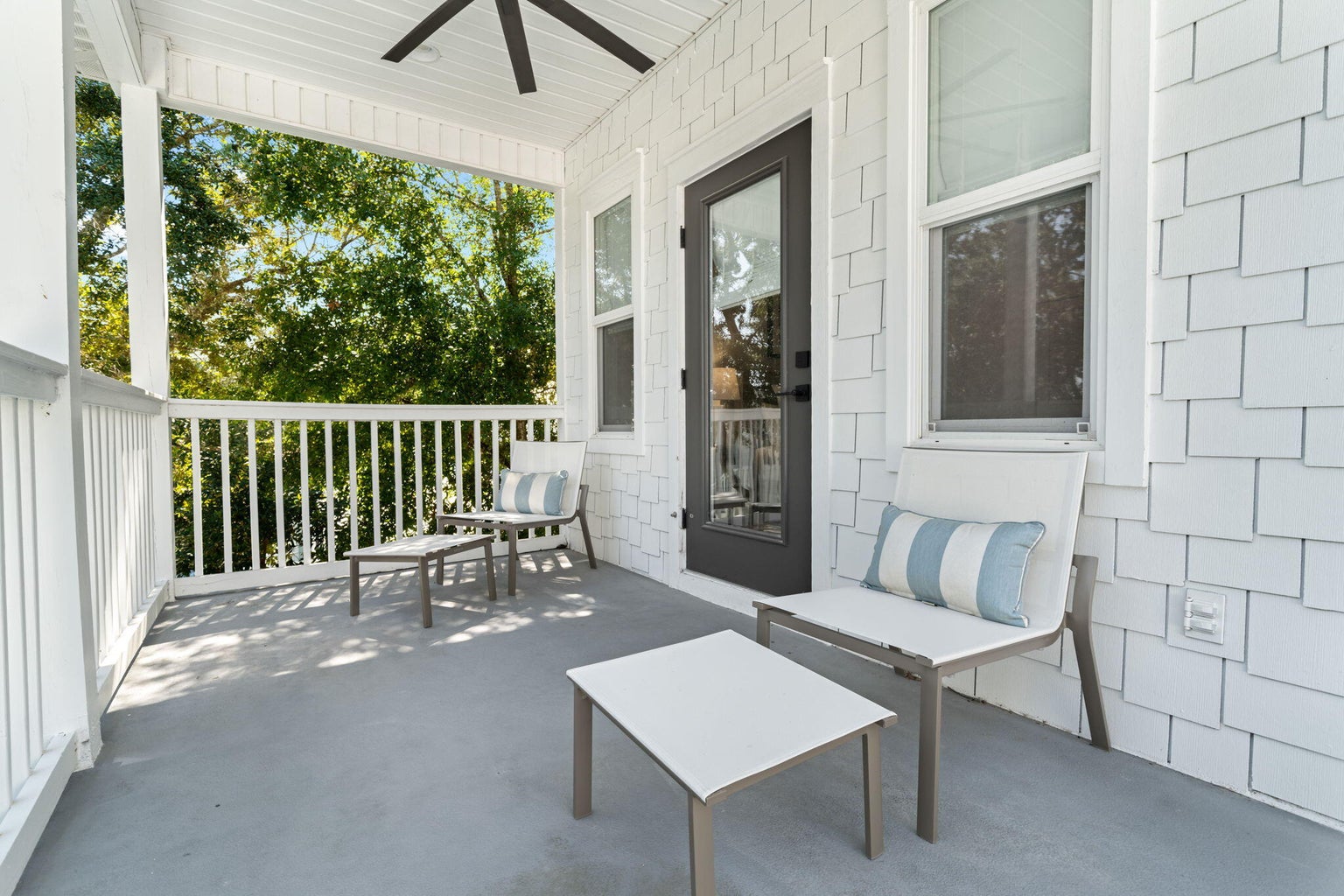 Seating on second floor rear porch, off of the 2nd floor primary suite.