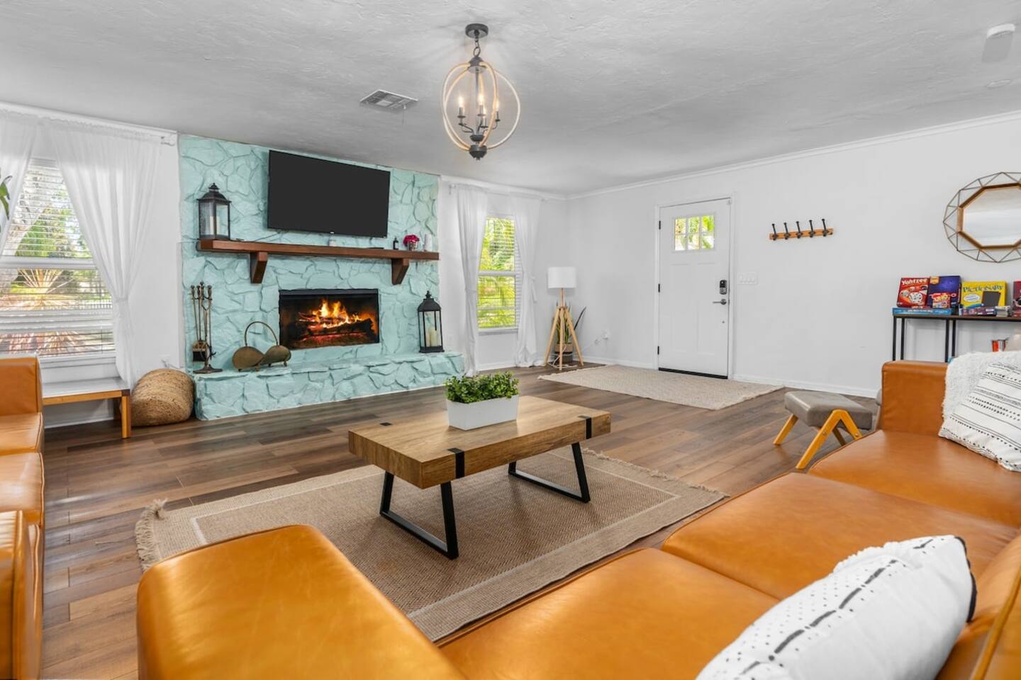 Newly decorated! Huge boho themed living room with 12-foot long custom dining table.