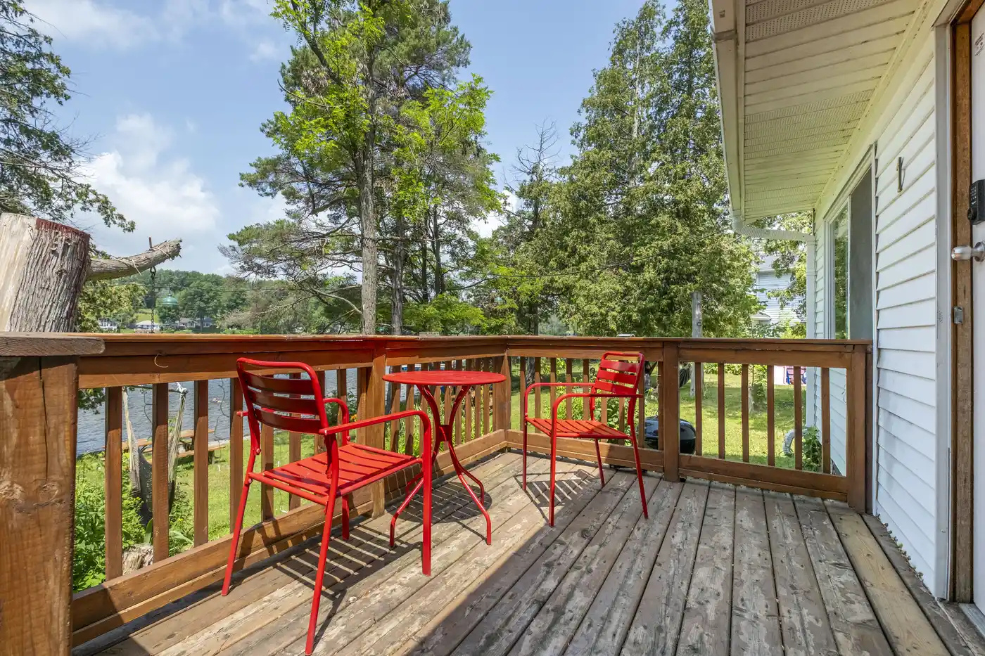 Outdoor deck with seating overlooking the property