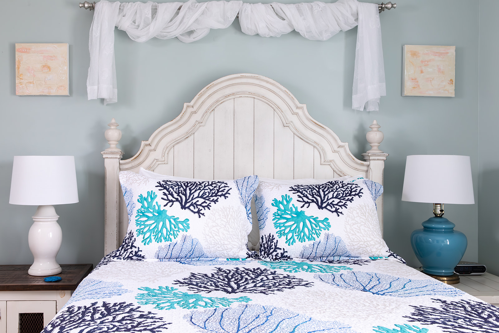 Settle into a comfortable queen bed dressed in hotel-quality linens and soft pillows at the end of the day. The room offers generous storage for clothing and personal items, with a closet, shelving, and bedside storage that make it easy to unpack, stay or
