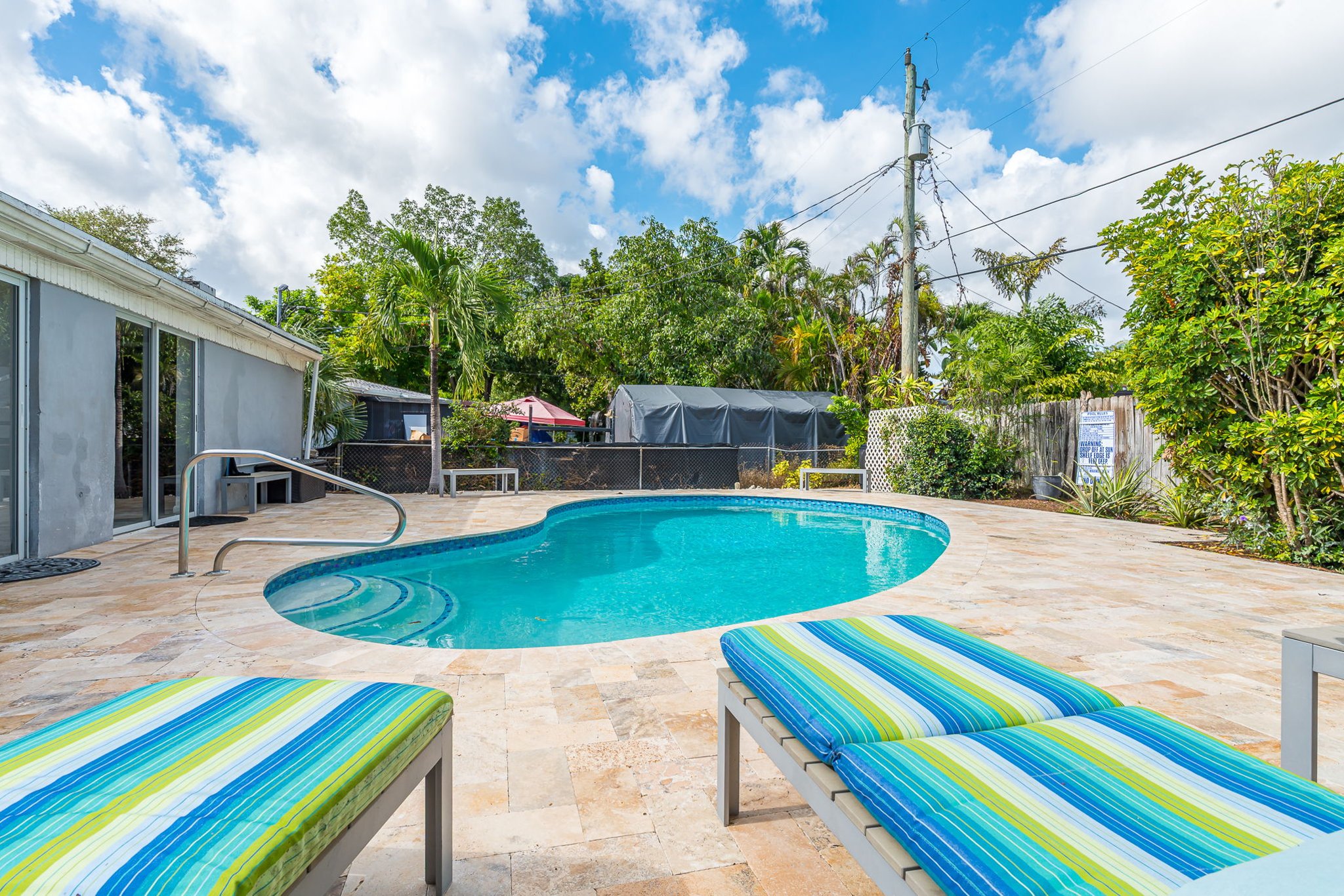 The outside is a highlight, with the heated pool, outdoor sun- loungers, BBQ and covered dining area.